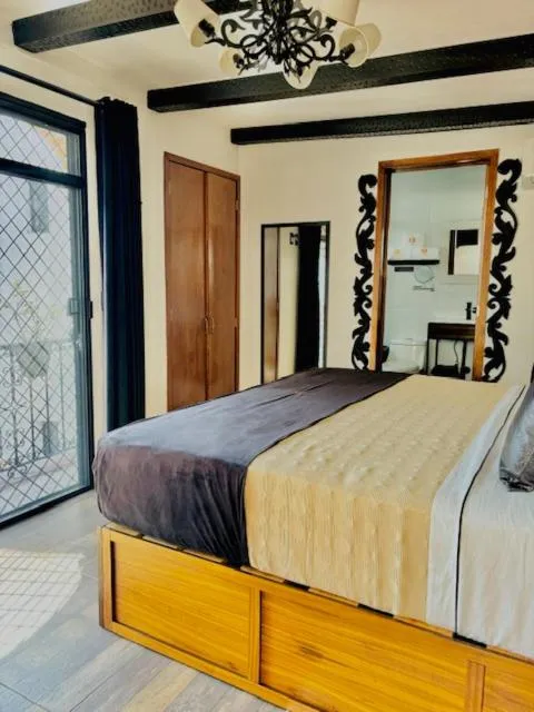 Photo of the whole room, Bed in Hotel Boutique La Mansión Guadalajara