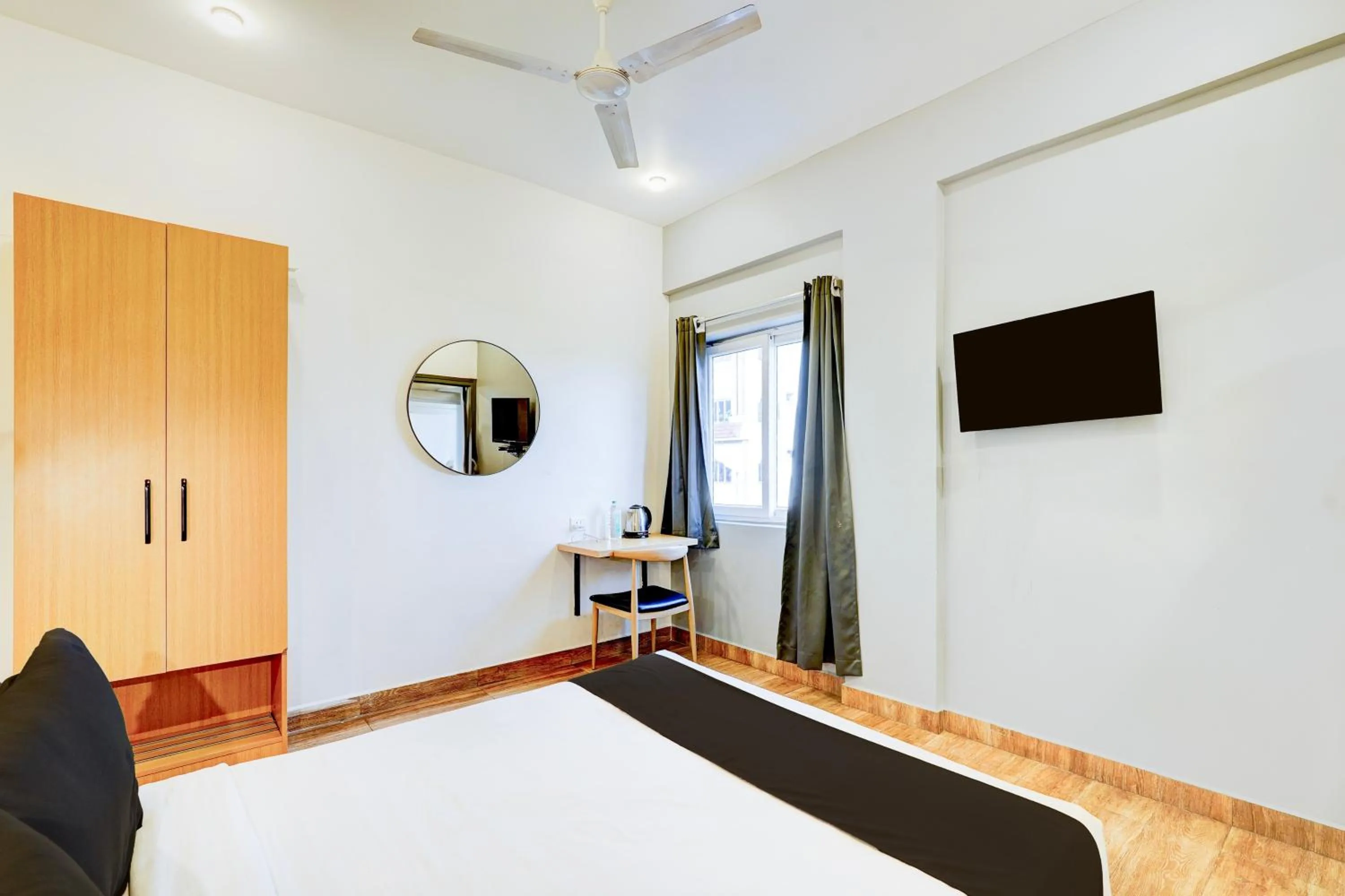 Bedroom, Bed in Super Townhouse Tirupati