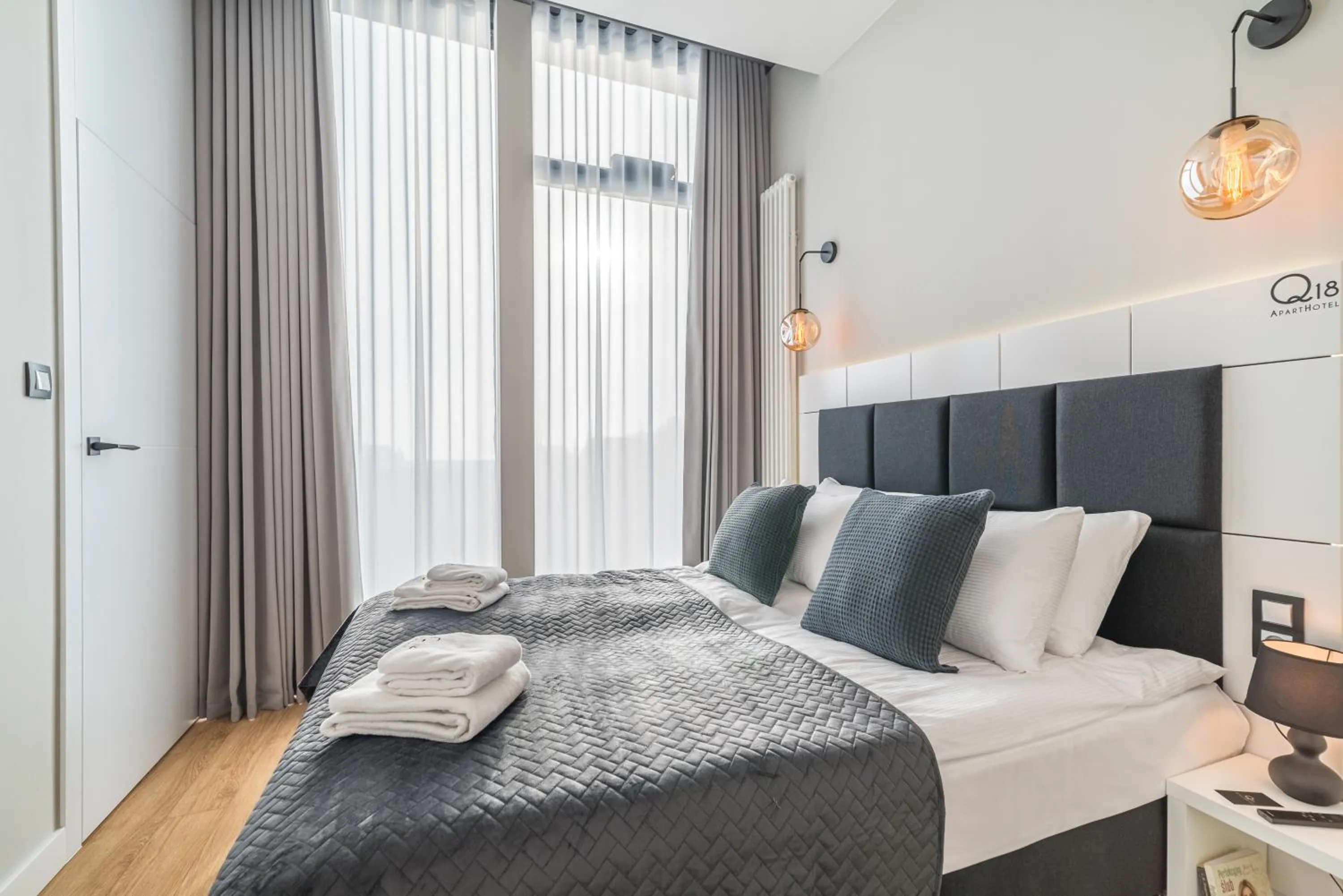 Bed in Q18 ApartHotel