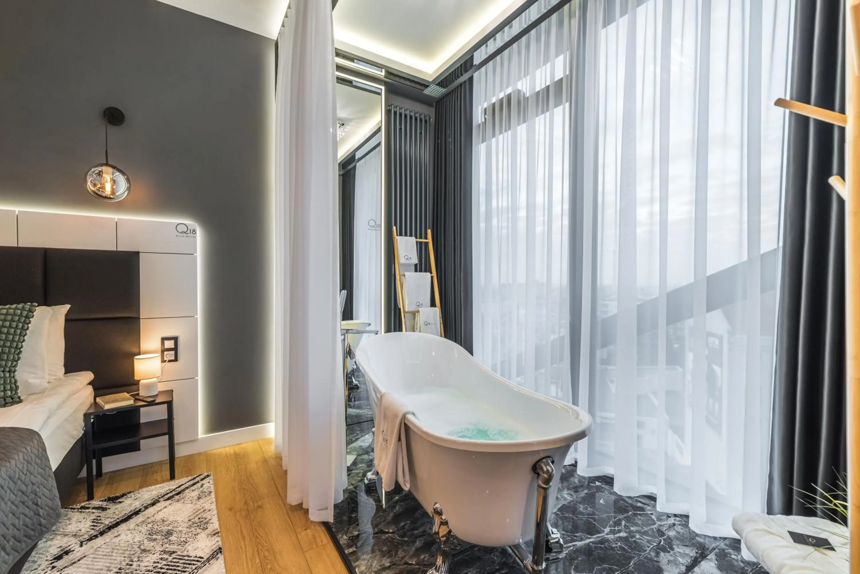 Bed in Q18 ApartHotel