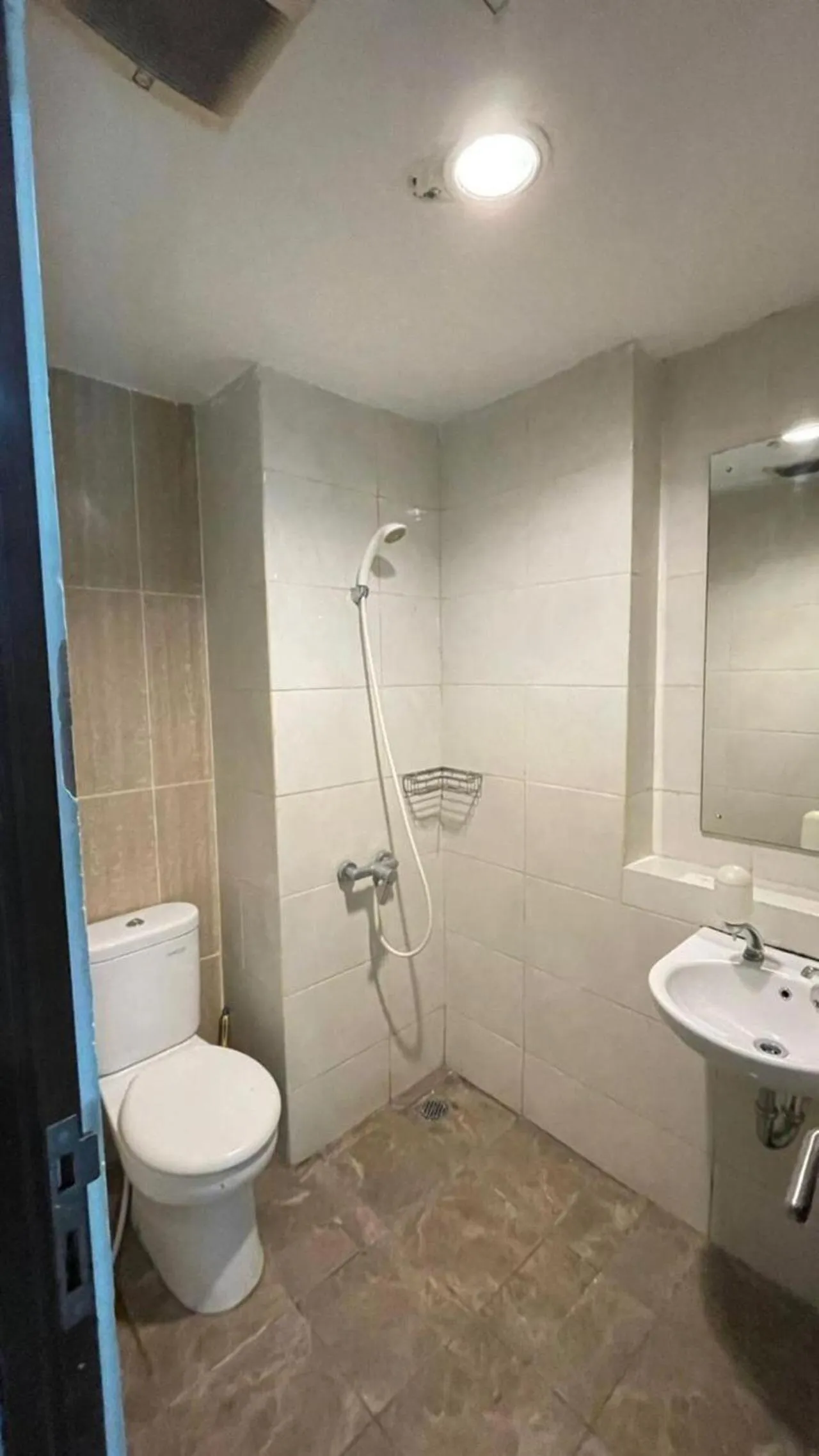 Bathroom in Apartemen Grand Dhika City by Nina