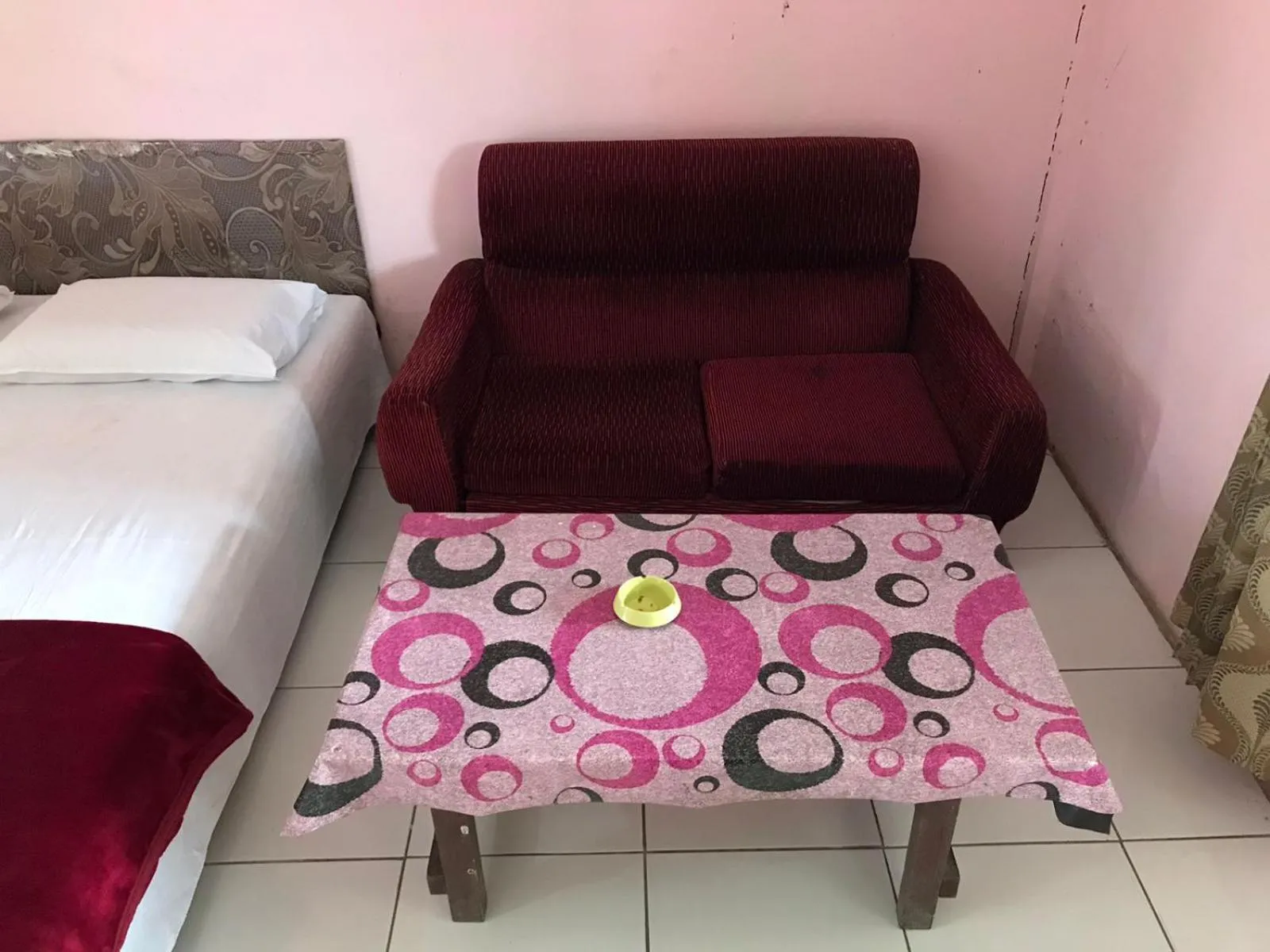 Seating area, Bed in Hotel Miranda at Desa Wisata Berastagi