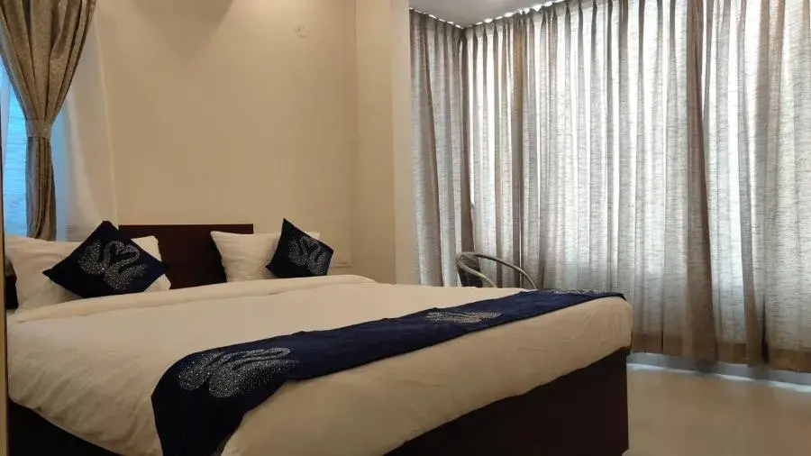 Bed in Hotel Amulya Fine Dine Bed in Hotel Amulya Fine Dine