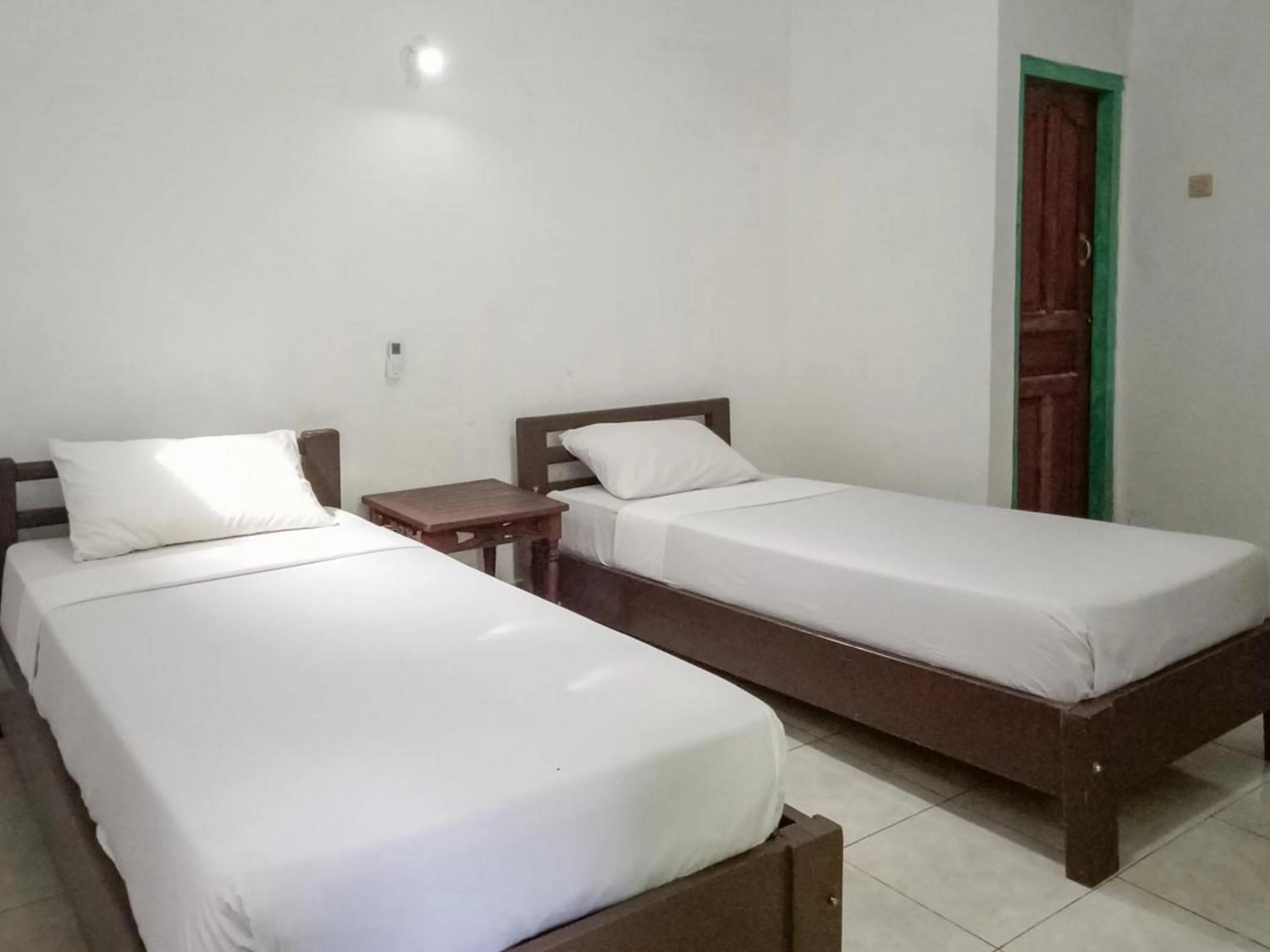 Bed in DATON HOUSE near Bali Zoo Ubud Mitra RedDoorz