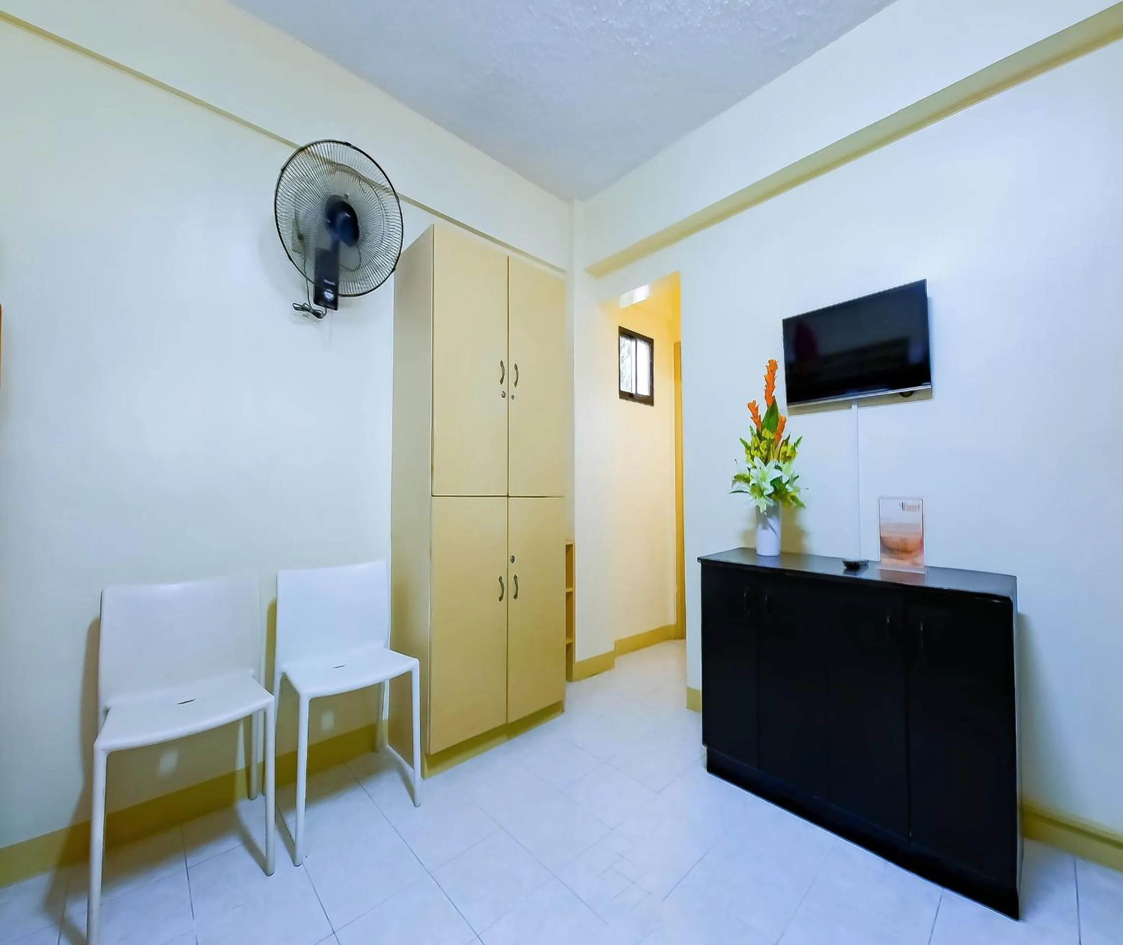 Bedroom in OYO 840 Orangenest Apartelle