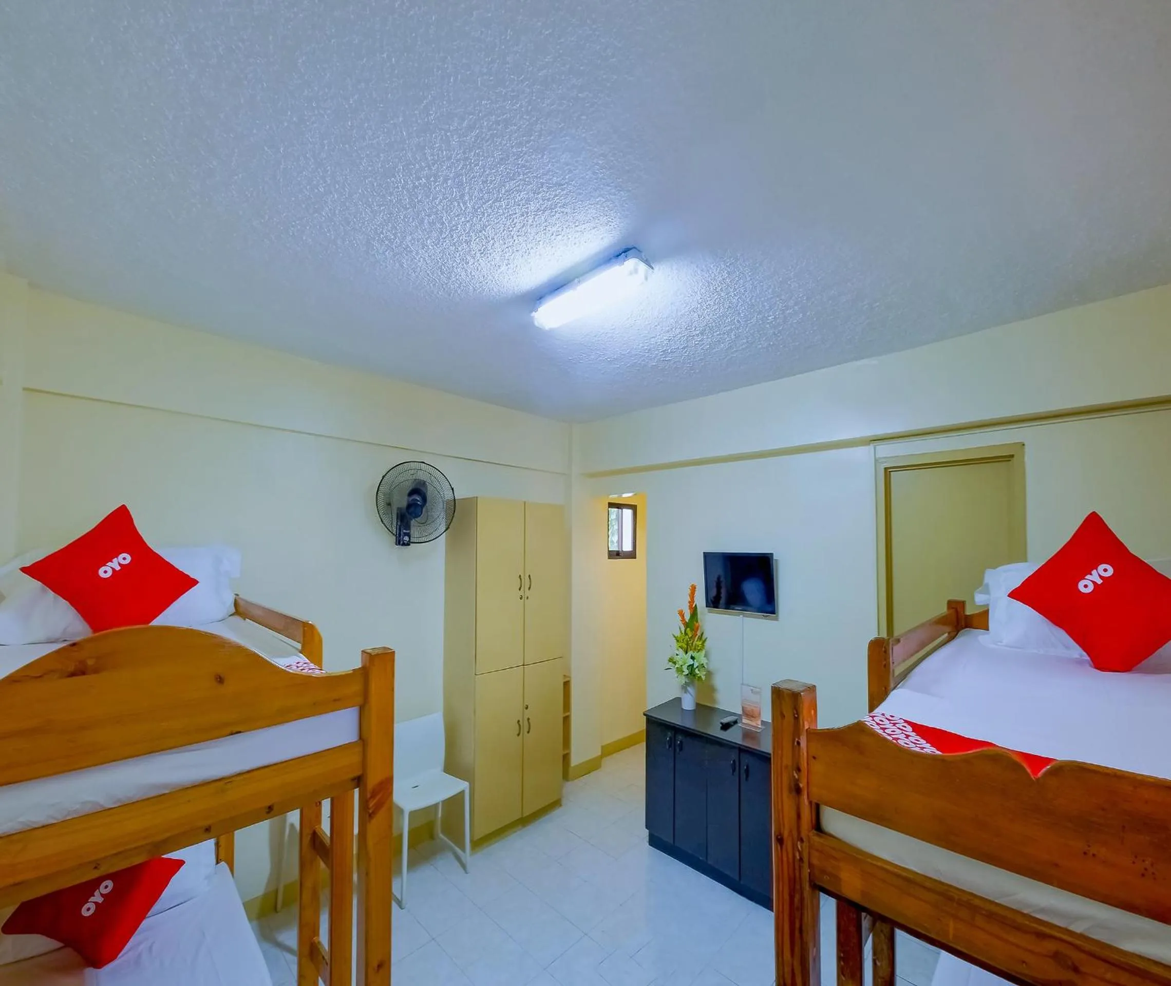 Bedroom in OYO 840 Orangenest Apartelle