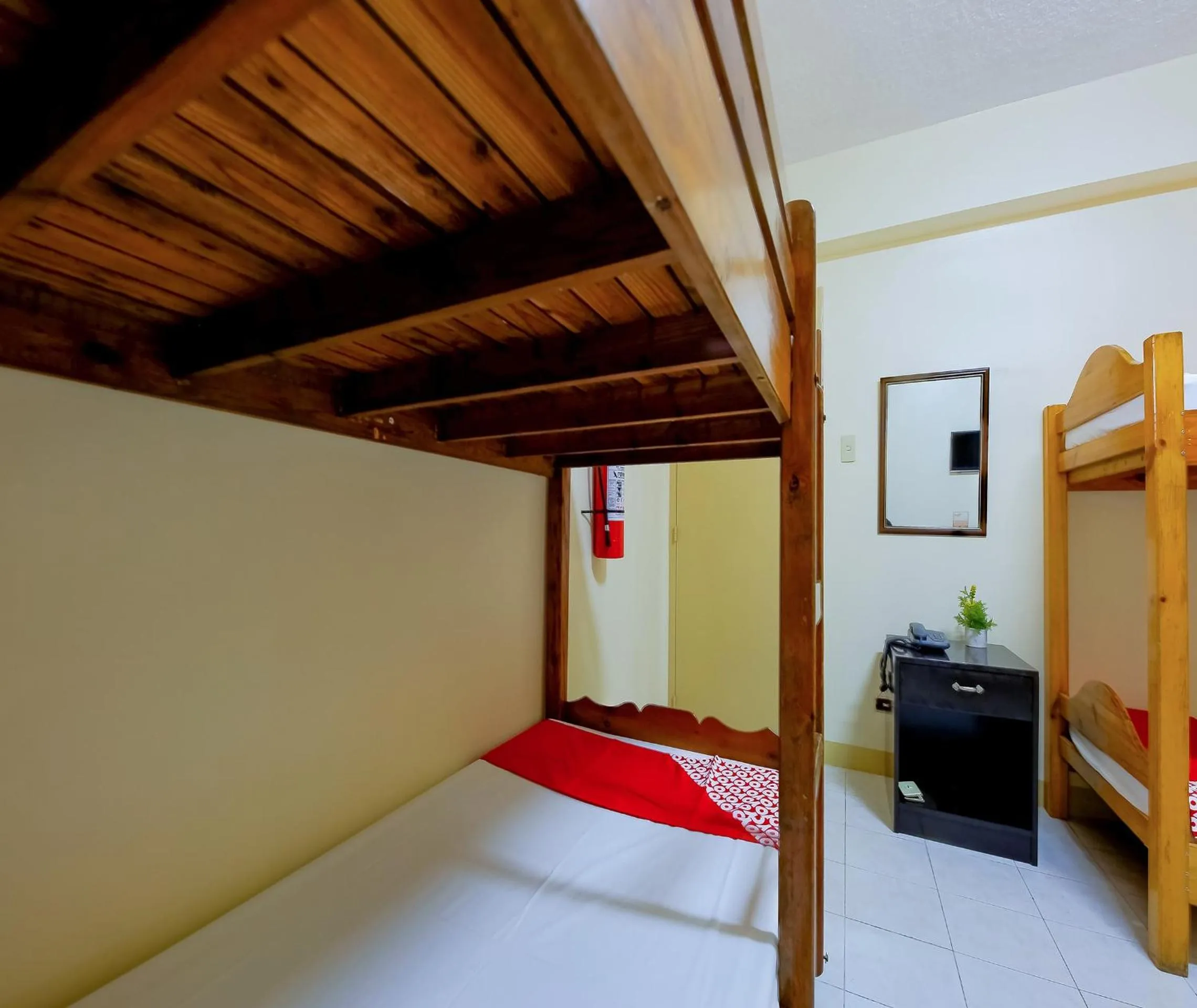 Bedroom in OYO 840 Orangenest Apartelle