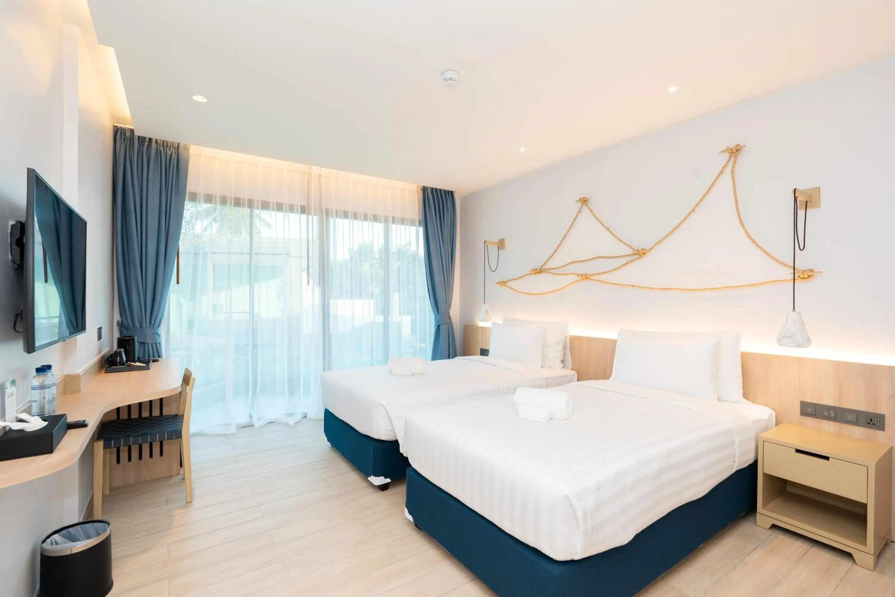 Bed in Panwaburi Beachfront Resort - SHA Extra Plus