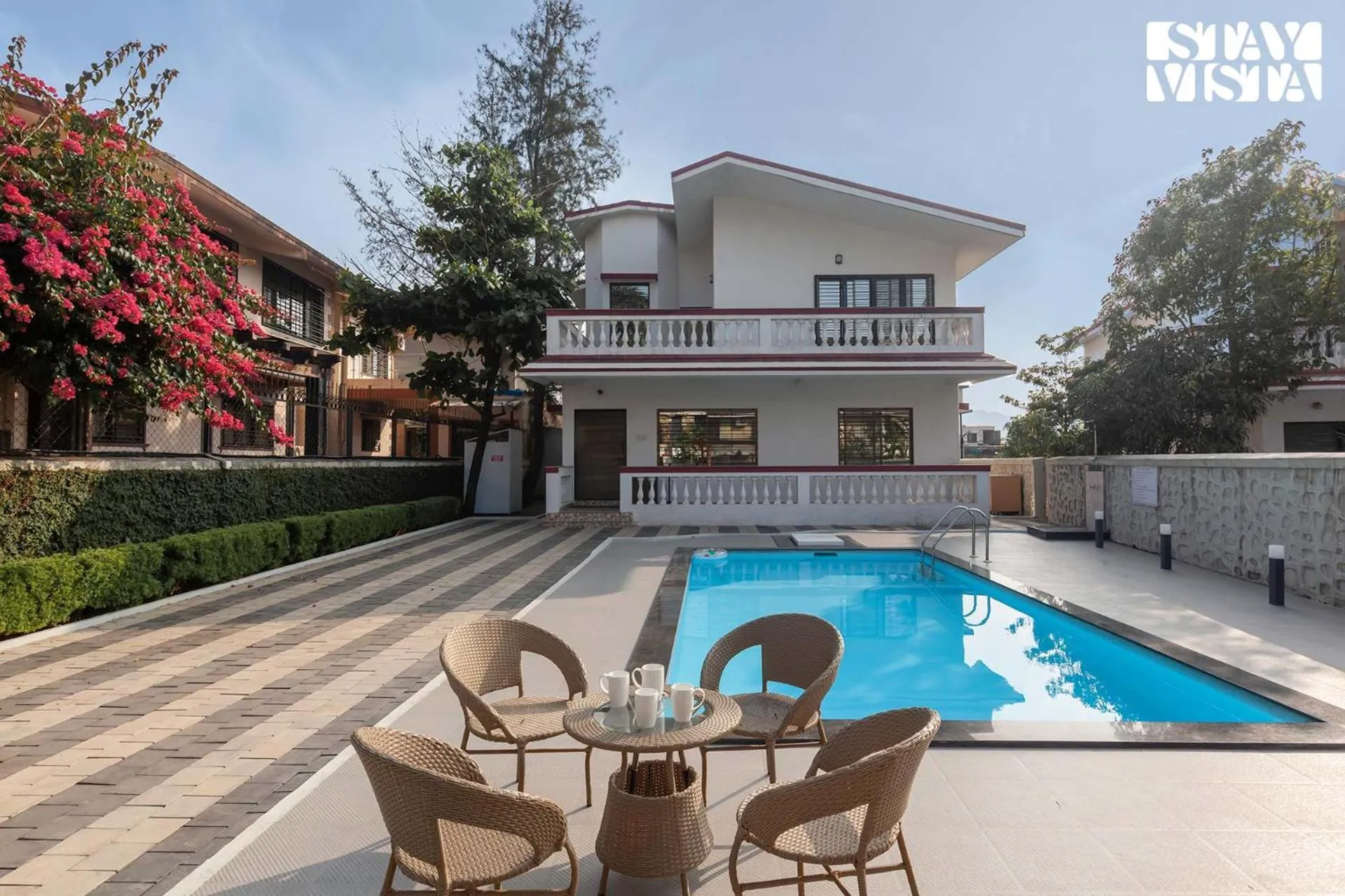 Swimming pool in StayVista's Brookvale Cottage - Dive into tranquility with pool view and gazebo