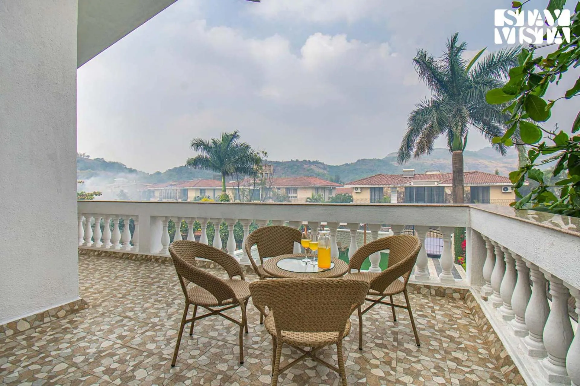 Balcony/Terrace in StayVista's Brookvale Cottage - Dive into tranquility with pool view and gazebo