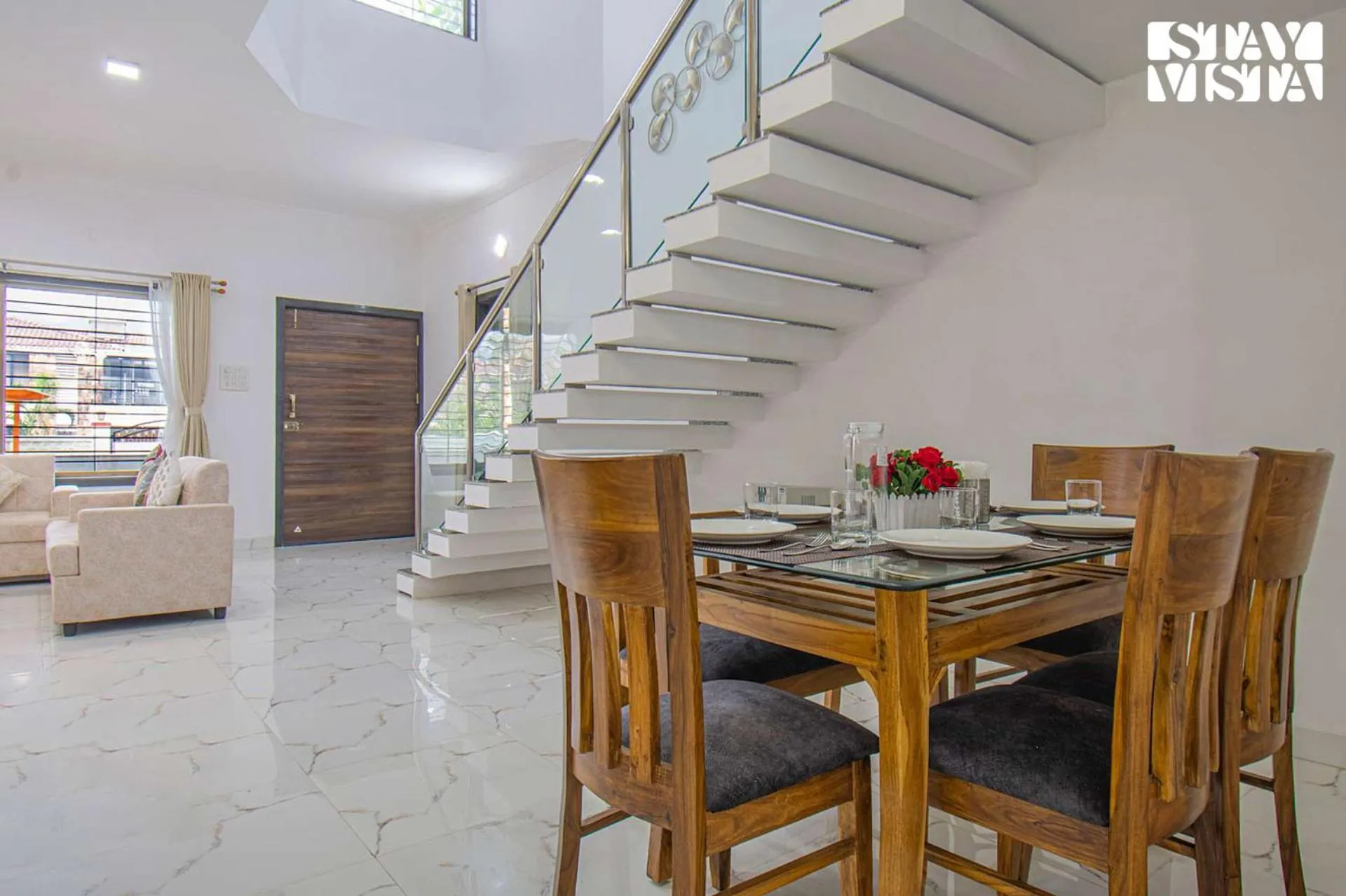 Living room in StayVista's Brookvale Cottage - Dive into tranquility with pool view and gazebo