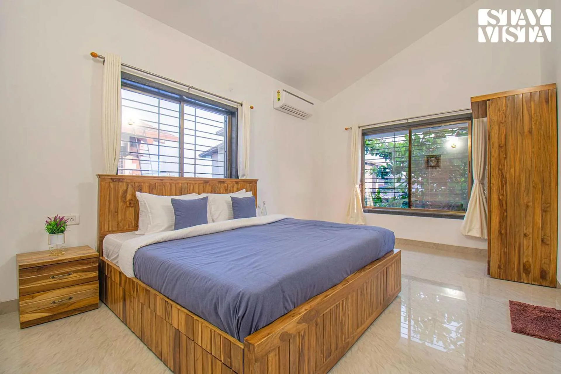 Bed in StayVista's Brookvale Cottage - Dive into tranquility with pool view and gazebo