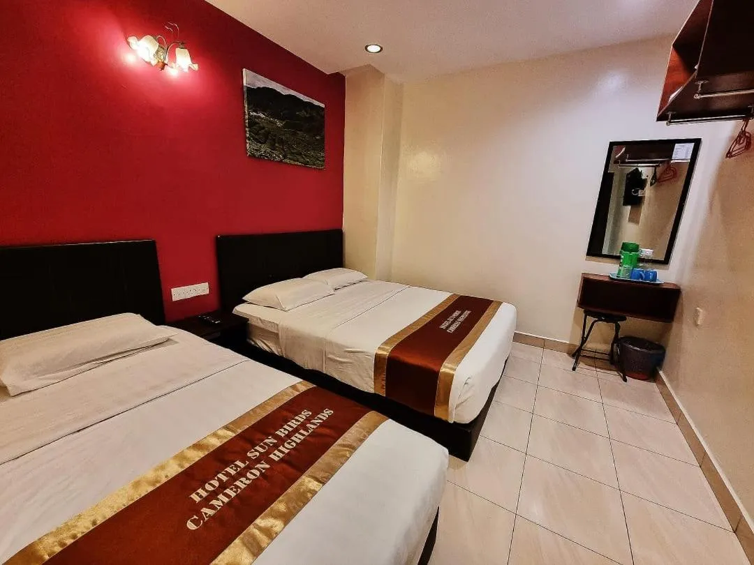 Bed in Hotel Sun Birds