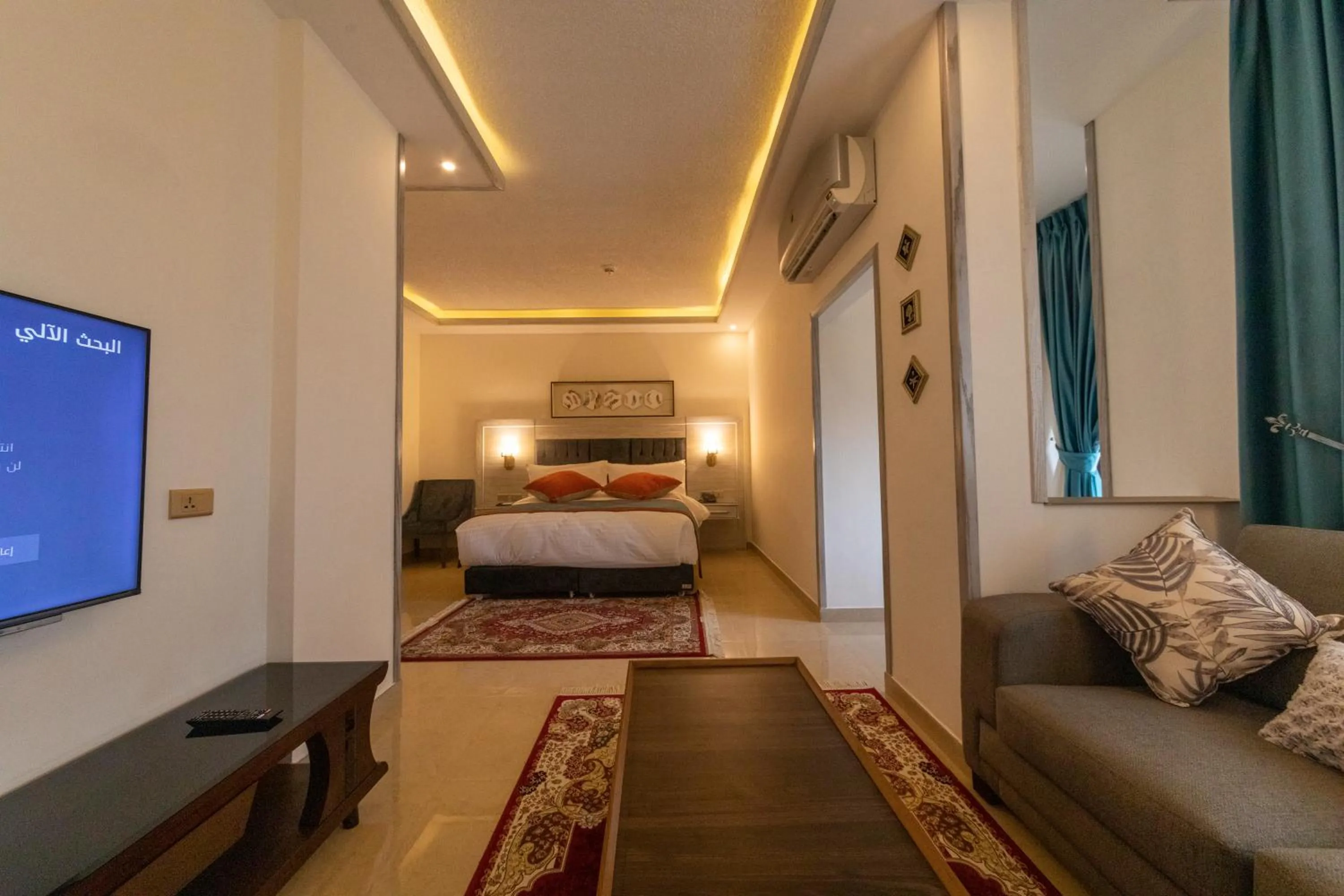 Living room, Bed in Petra Canyon Hotel