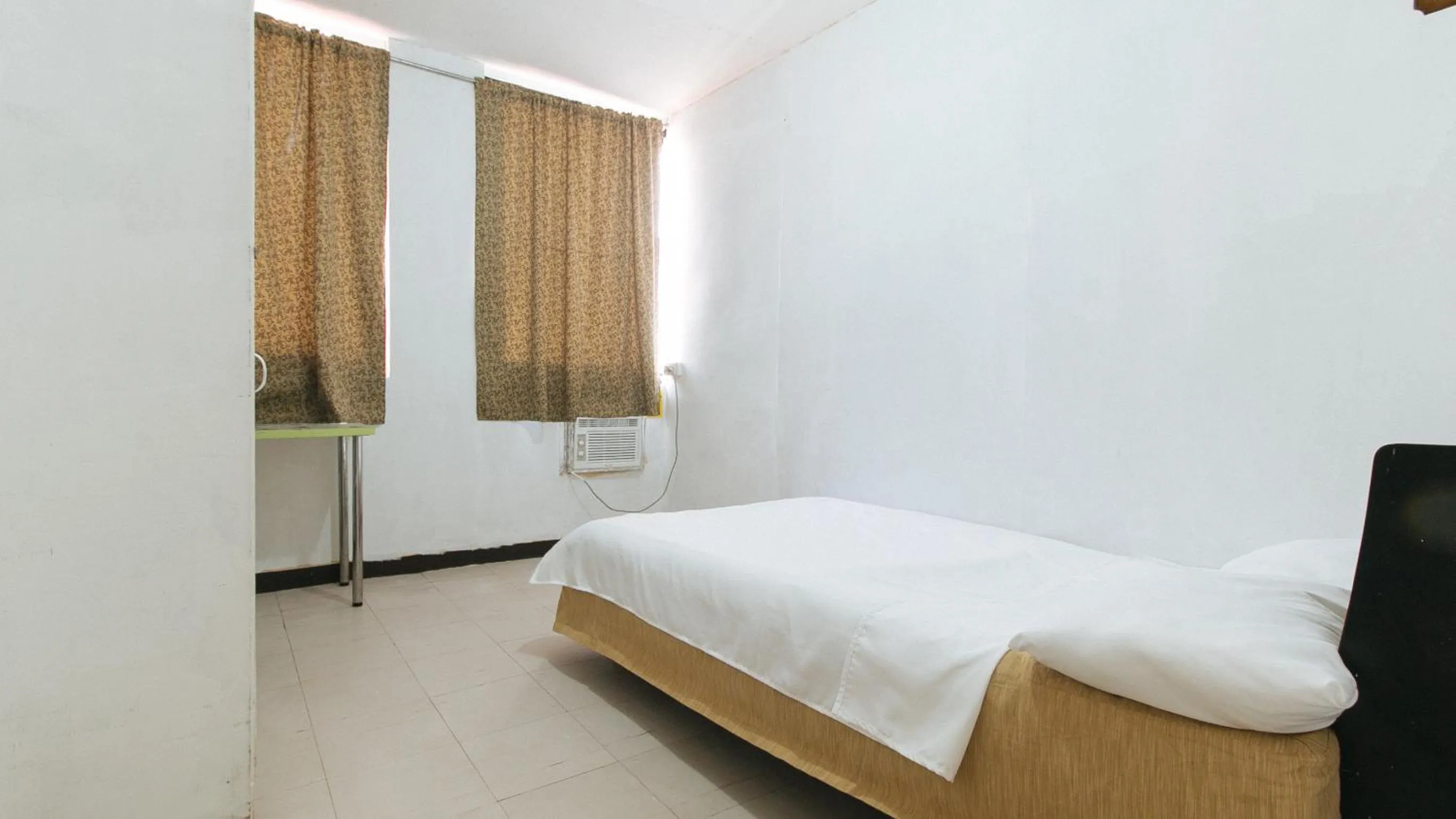 Photo of the whole room, Bed in Cristian Jay Dormitory by RedDoorz