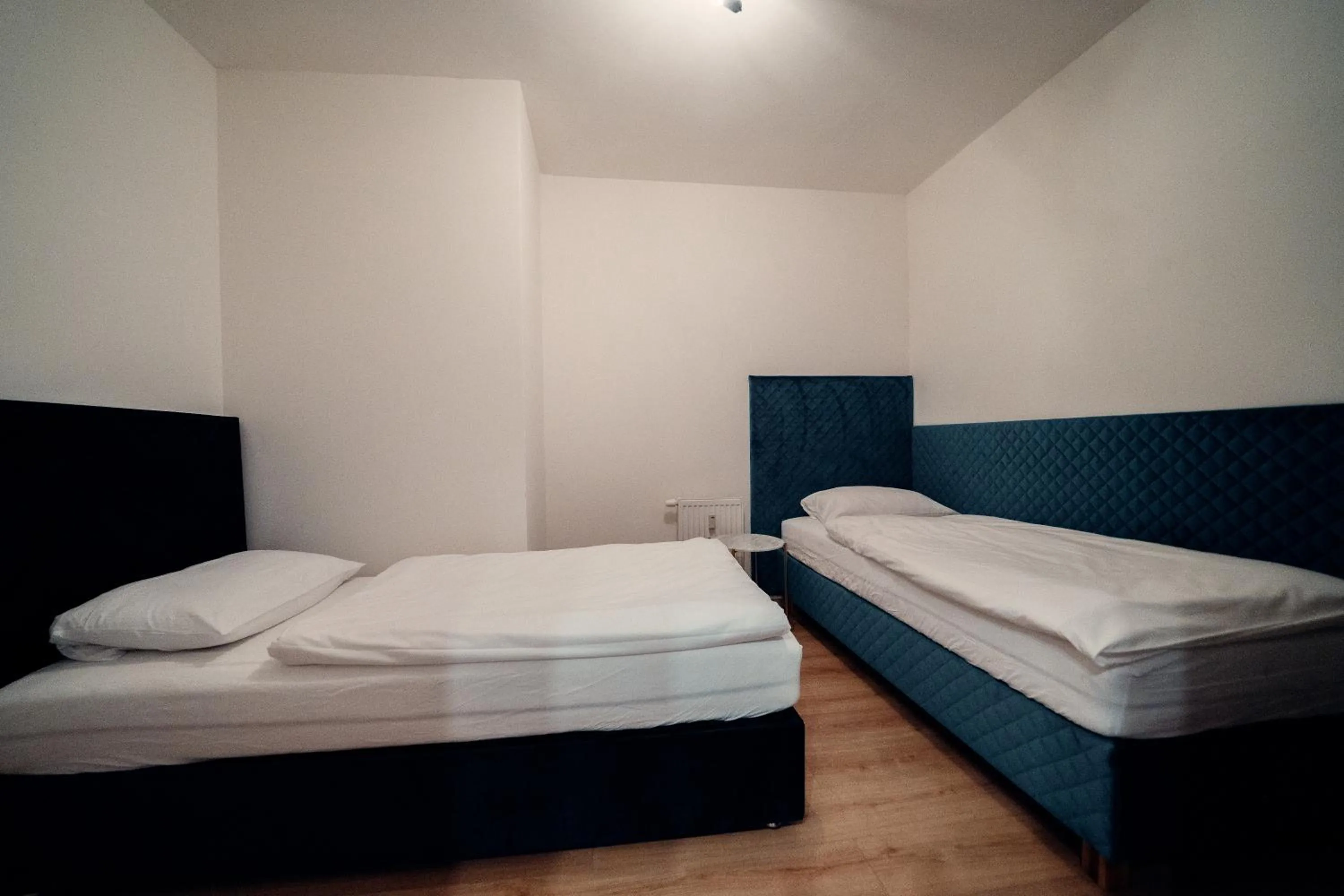 Bed in TIFFANY Apartment Hotel