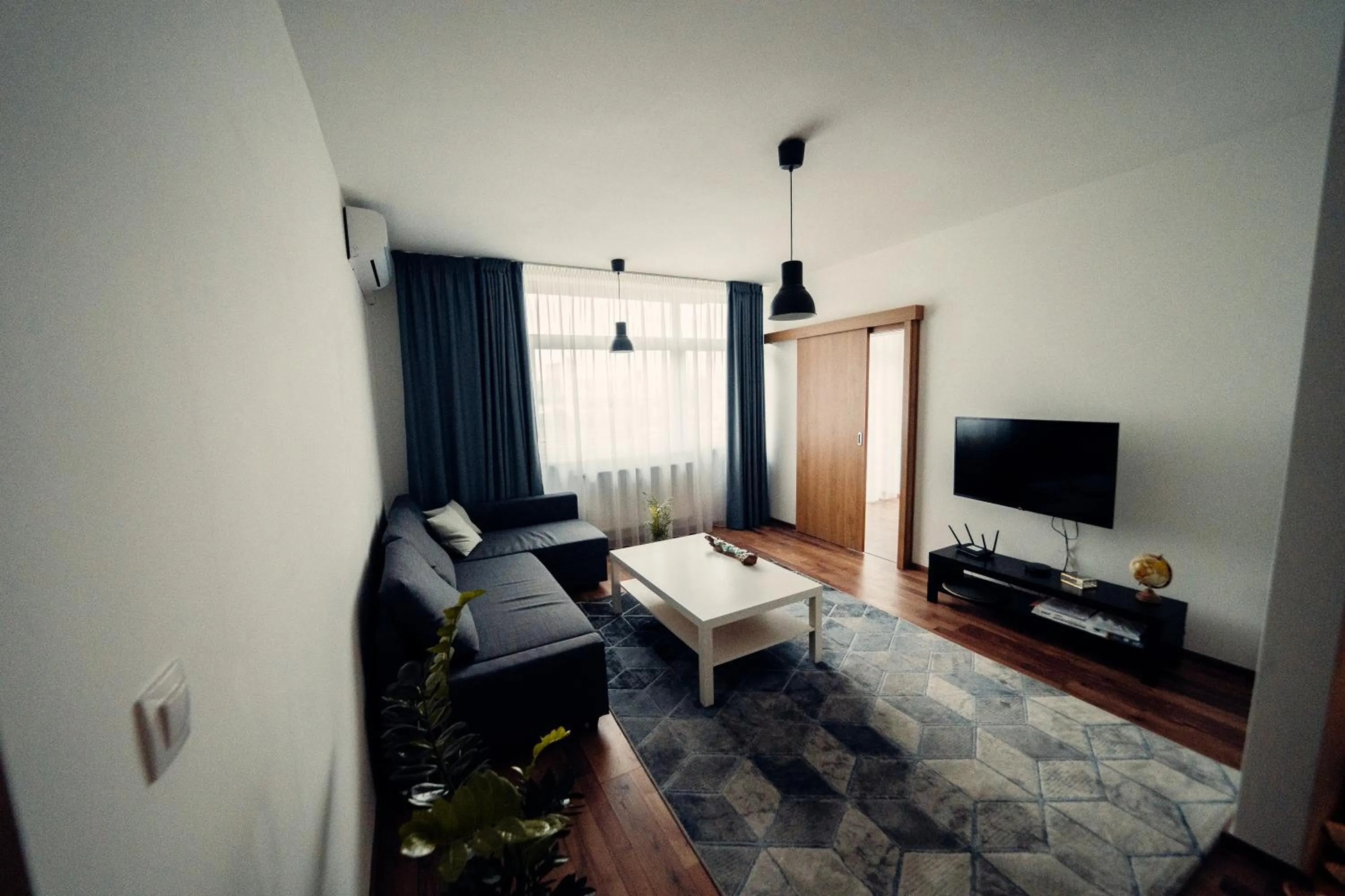 Communal lounge/ TV room, Bed in TIFFANY Apartment Hotel