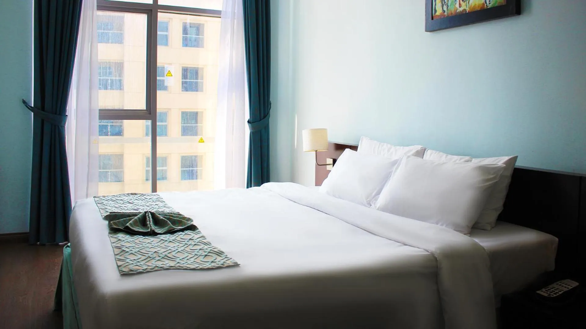 Bed in Signature Hotel Apartments and Spa