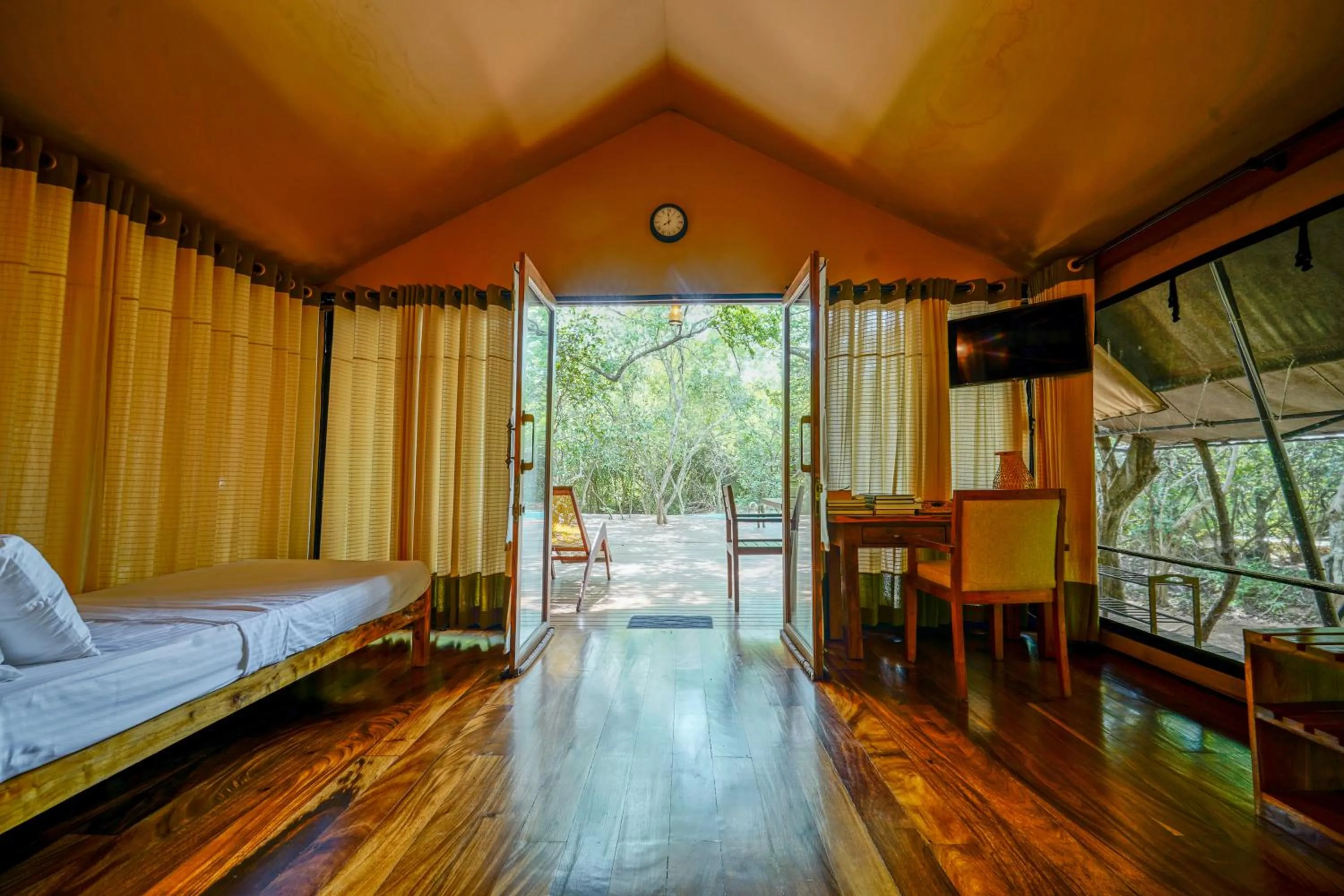 Communal lounge/ TV room, Bed in Leopard Reach Yala by Seven Angels