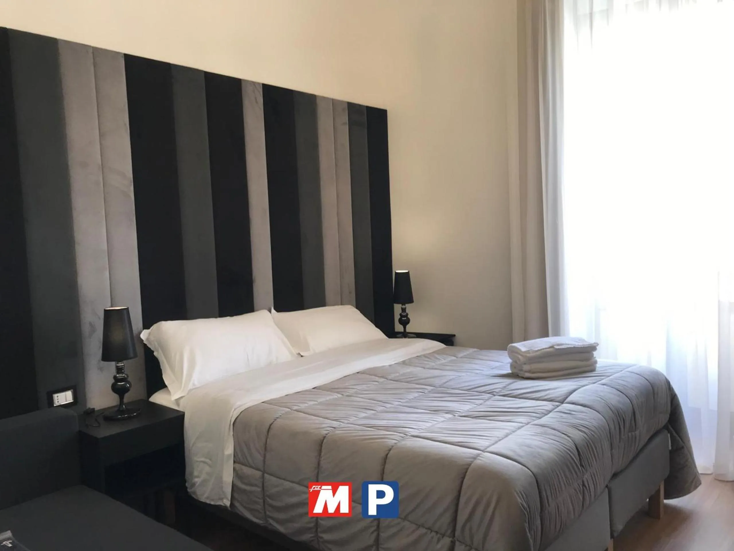 Bed in Motta Palace Apartments & Rooms