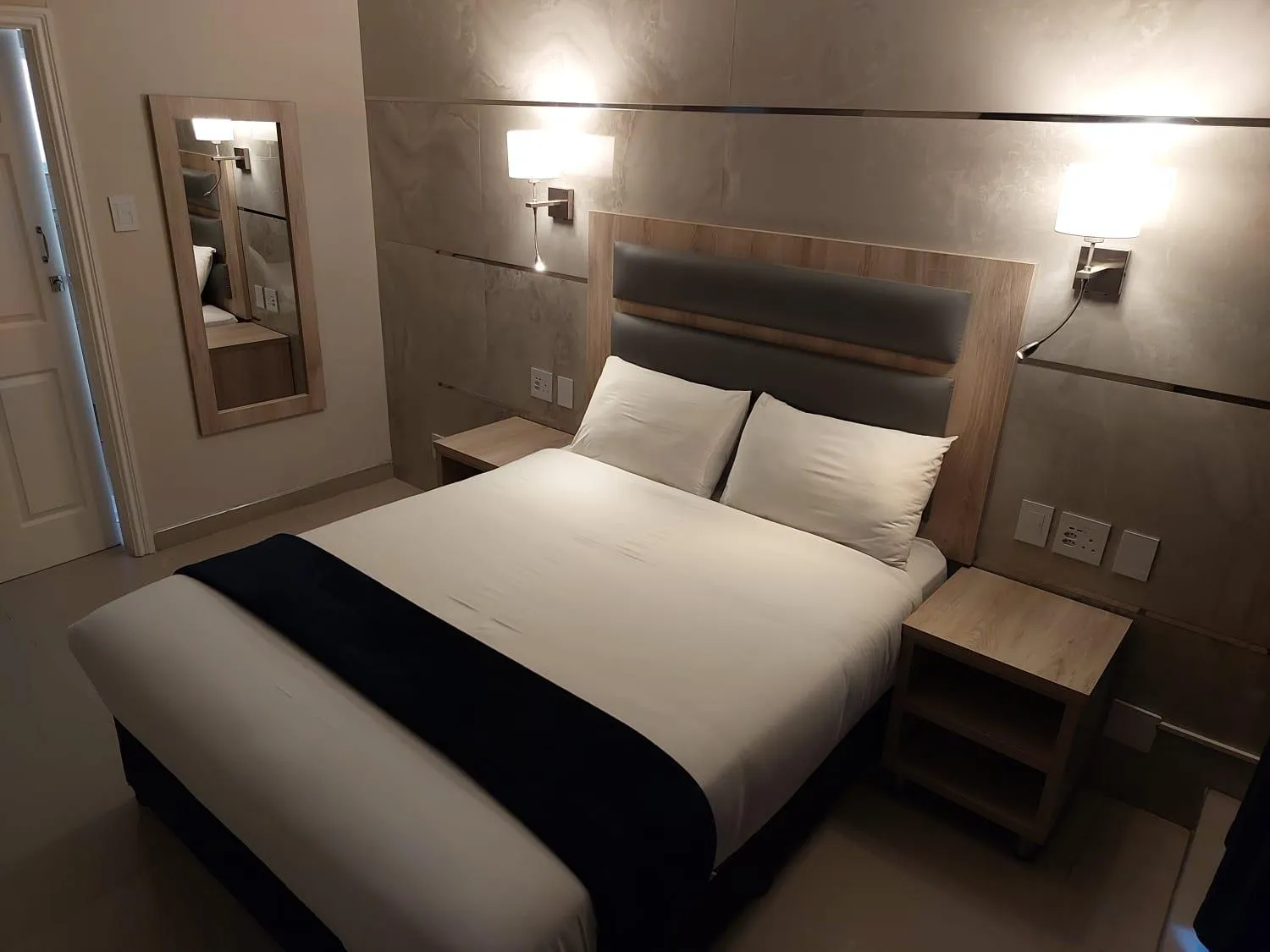 Bed in Bayside Taj Hotel