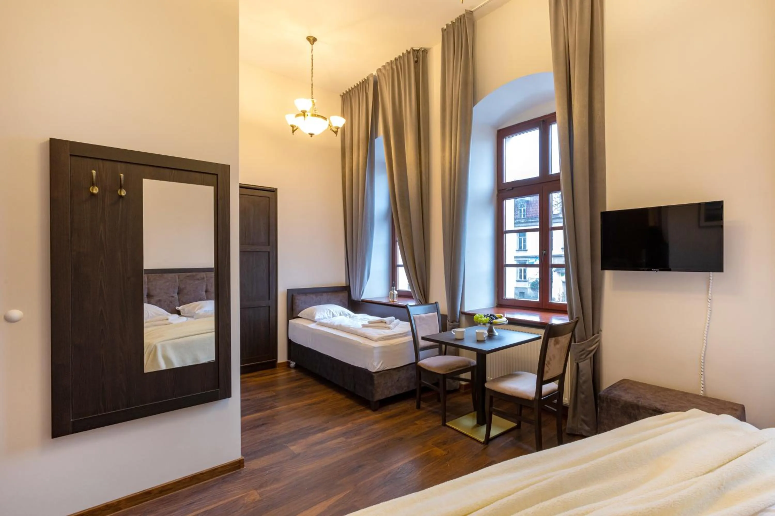 TV and multimedia, Bed in ZEPPELIN APARTMENTS Simple Acomodation