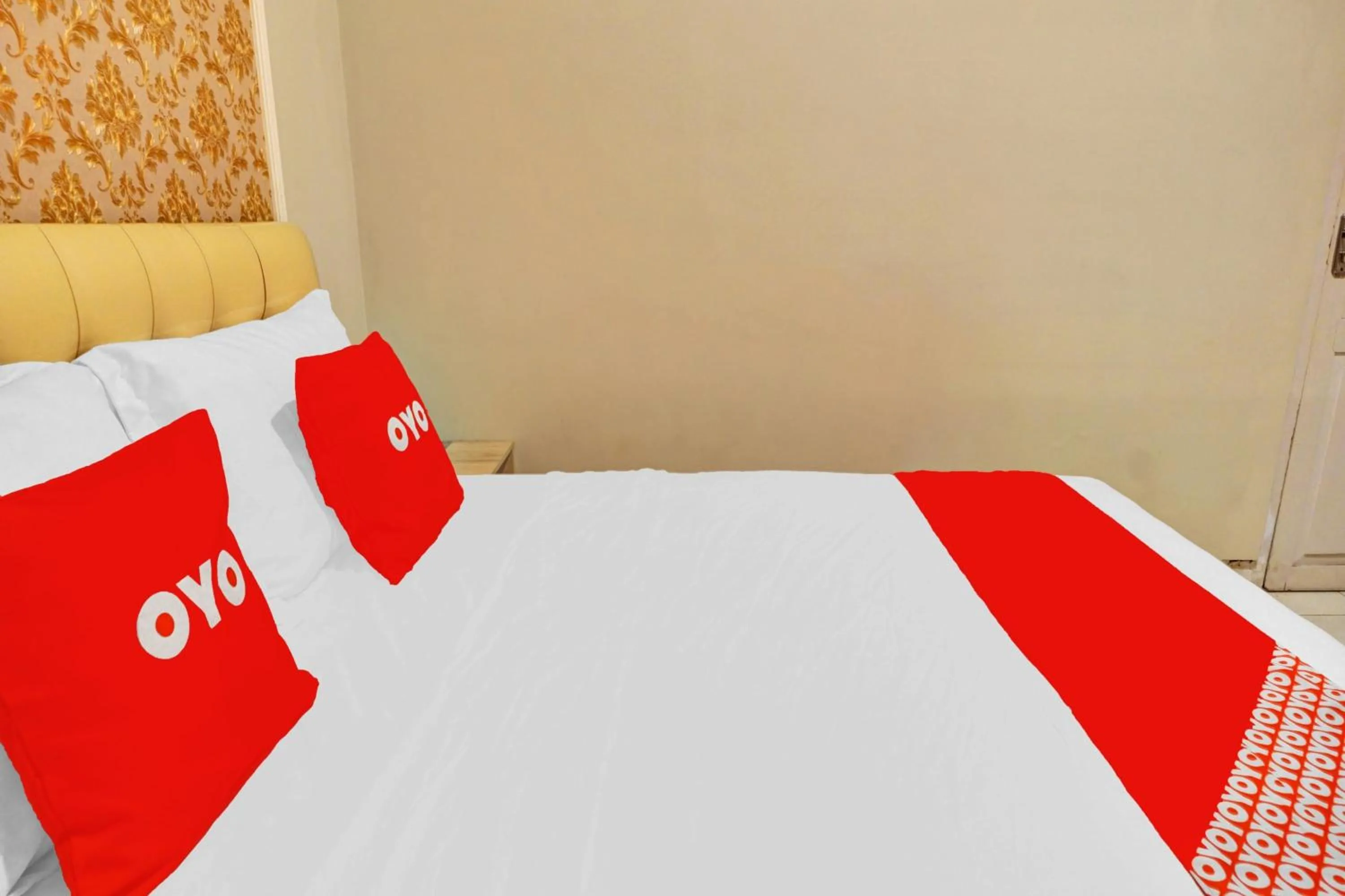 Bedroom in Hotel O Btc Guest House Syariah