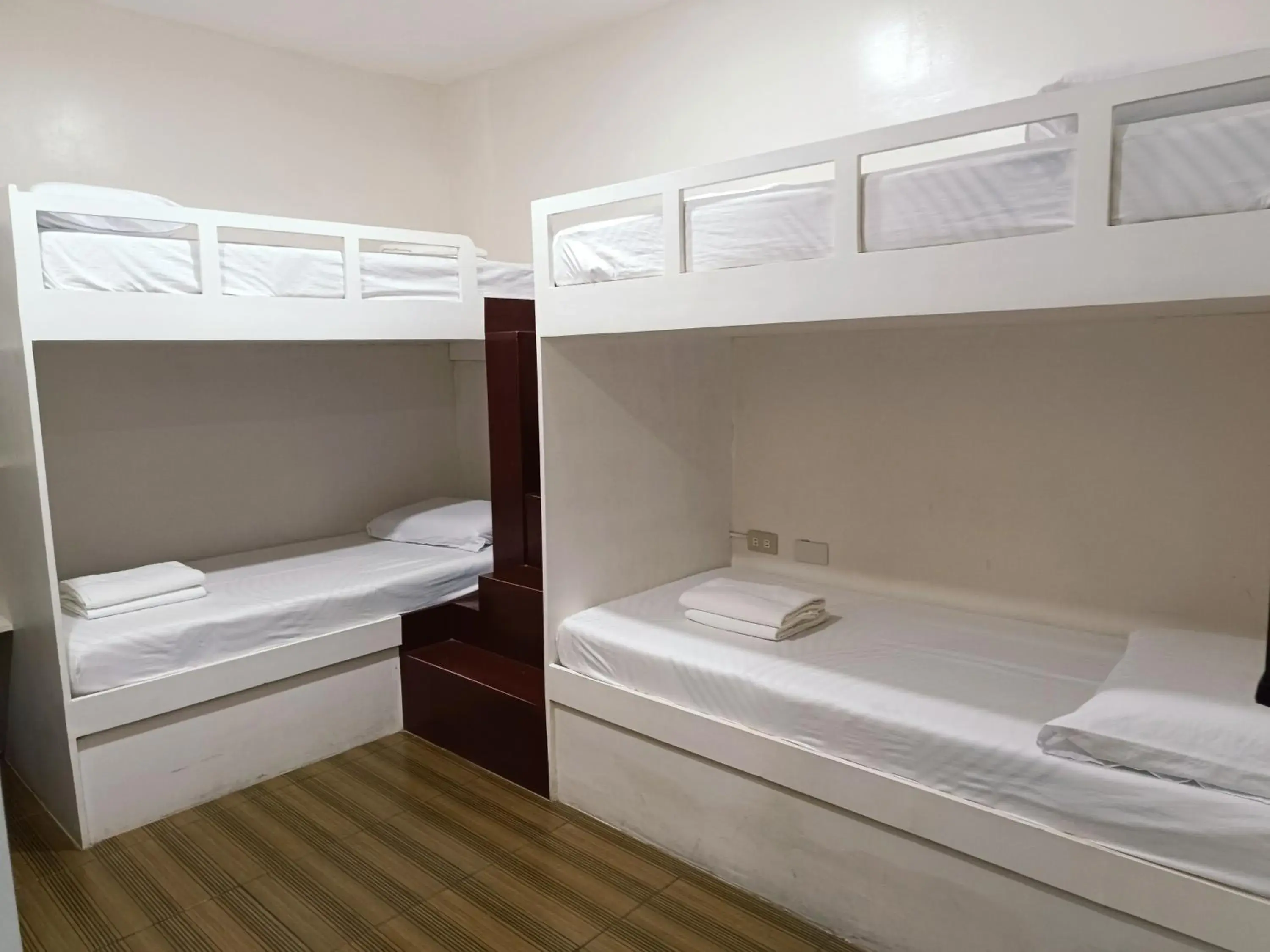 Bed in FB Dormitel Suites Bed in FB Dormitel Suites