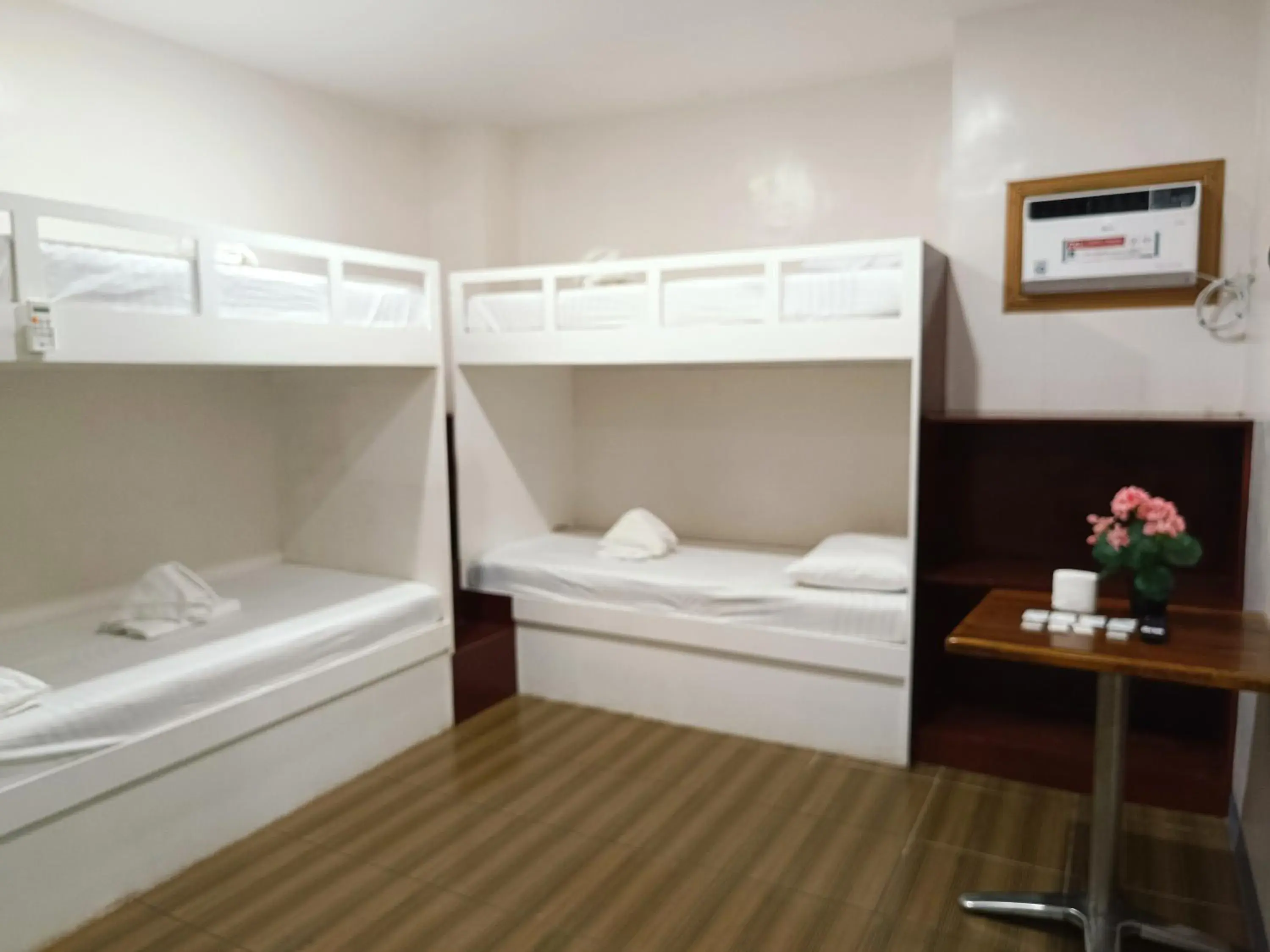 Bed in FB Dormitel Suites Bed in FB Dormitel Suites