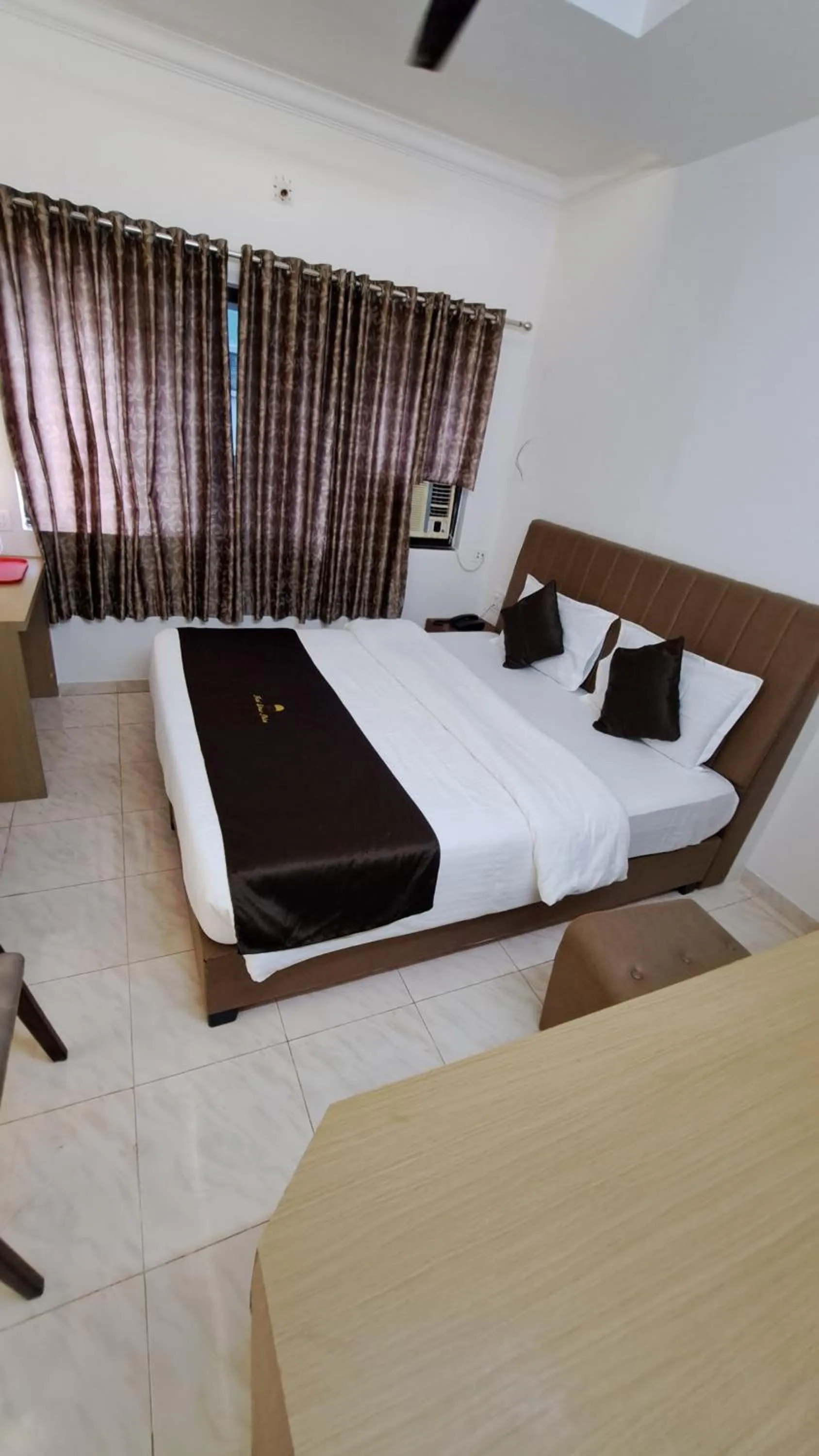 Bed in Hotel Dhruv Palace