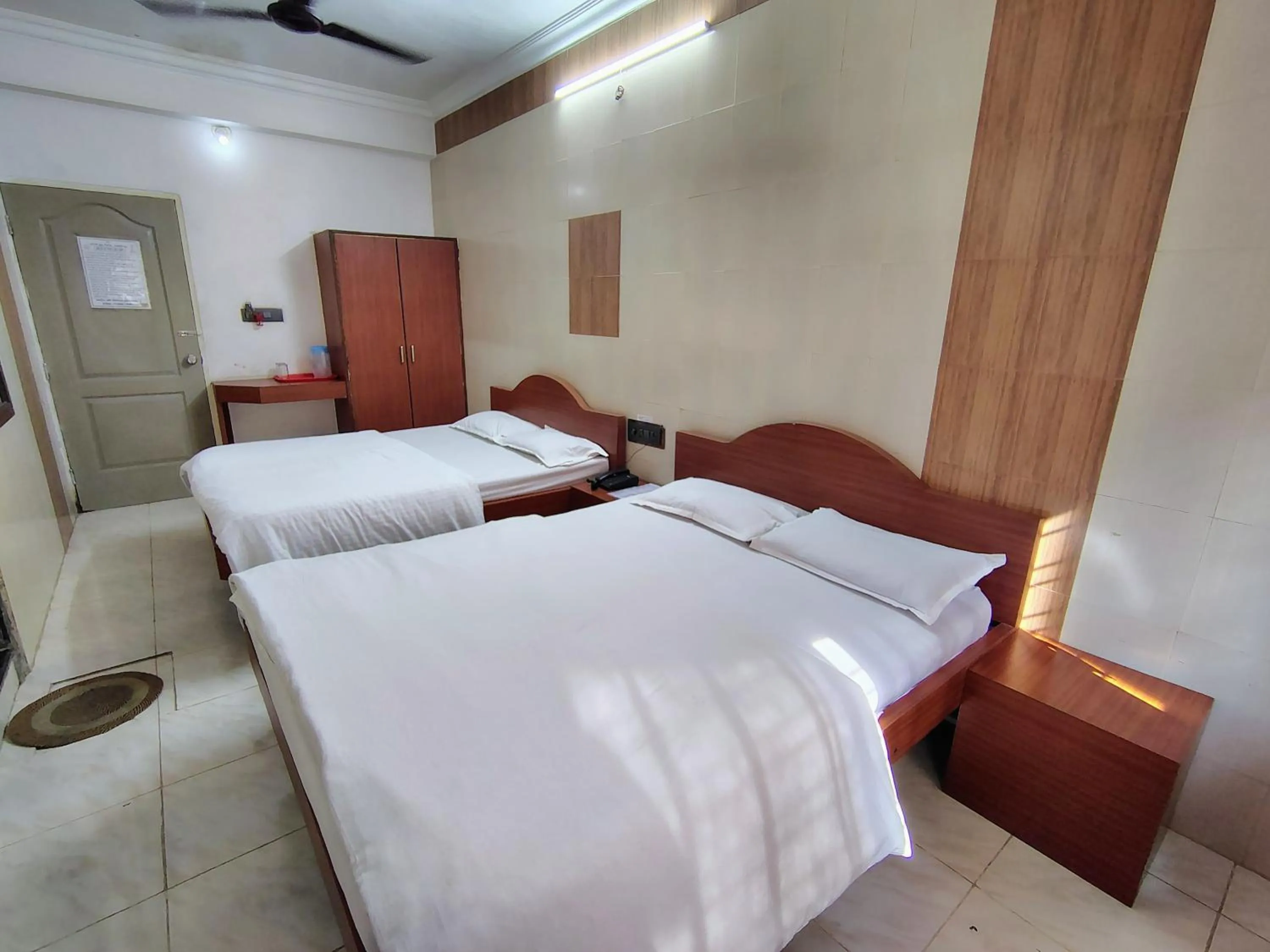 Bed in Hotel Dhruv Palace