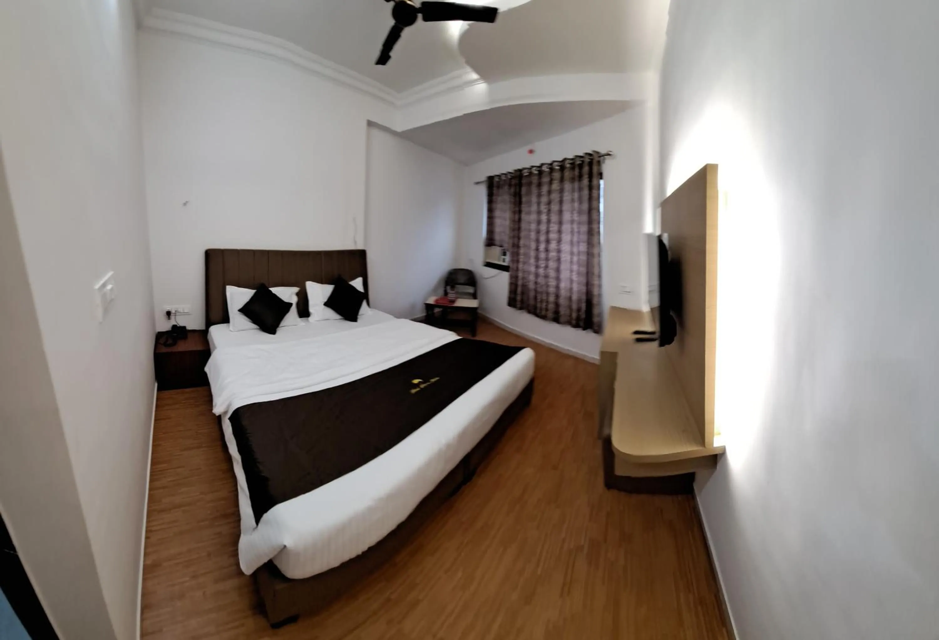 Bed in Hotel Dhruv Palace