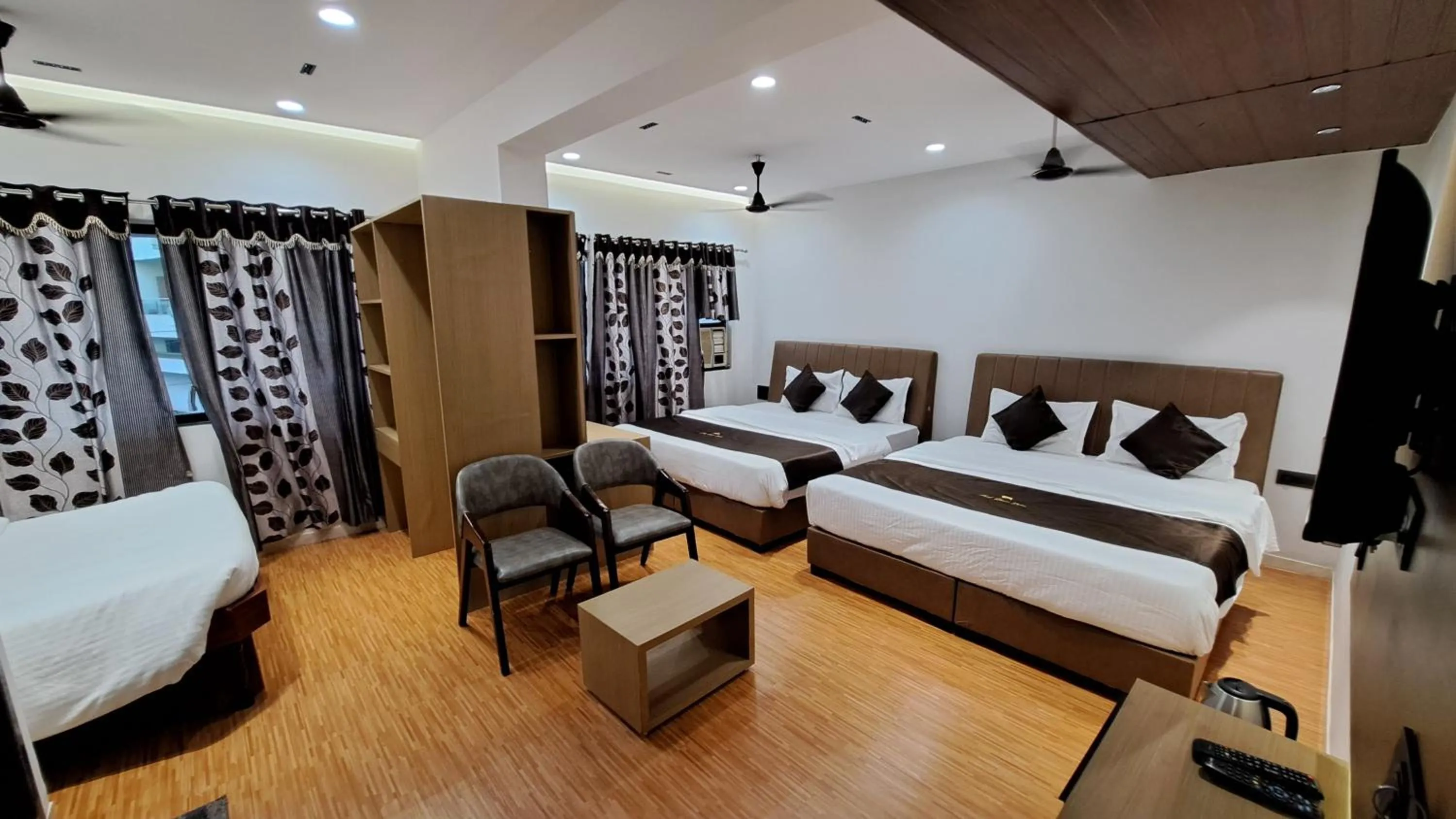 Bed in Hotel Dhruv Palace