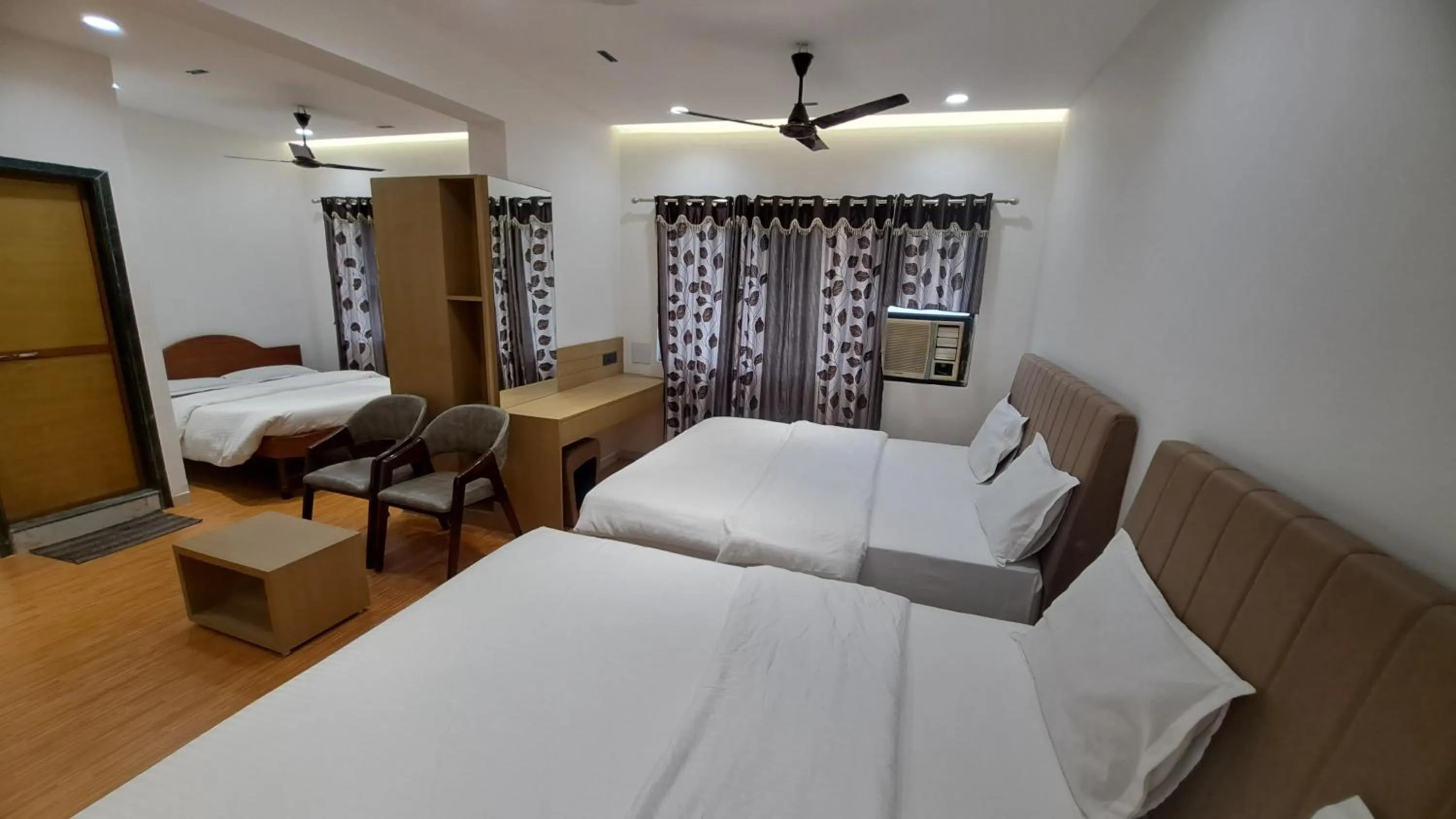 Bed in Hotel Dhruv Palace