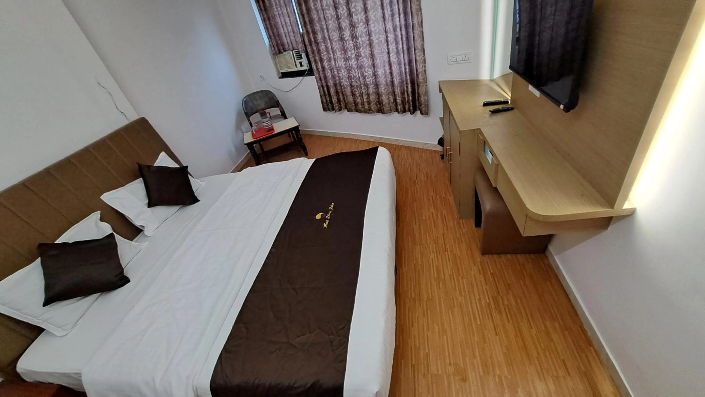 Bed in Hotel Dhruv Palace