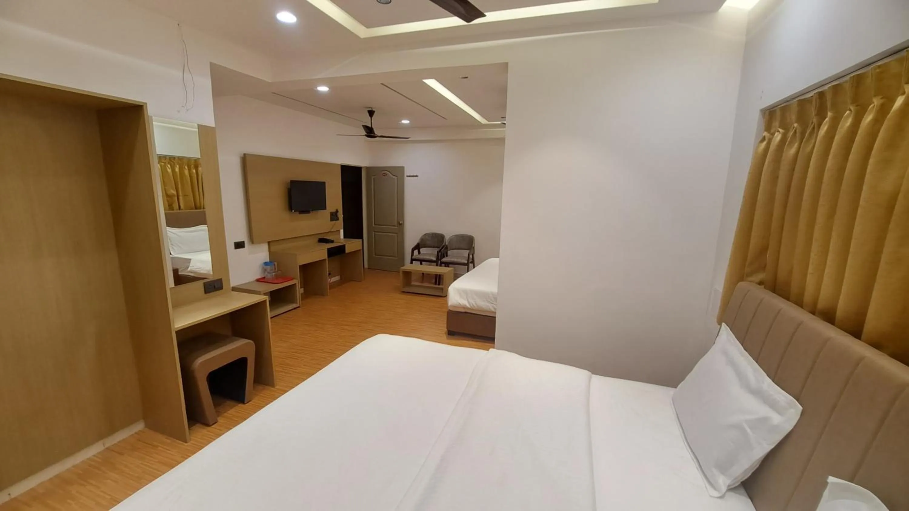 Bed in Hotel Dhruv Palace