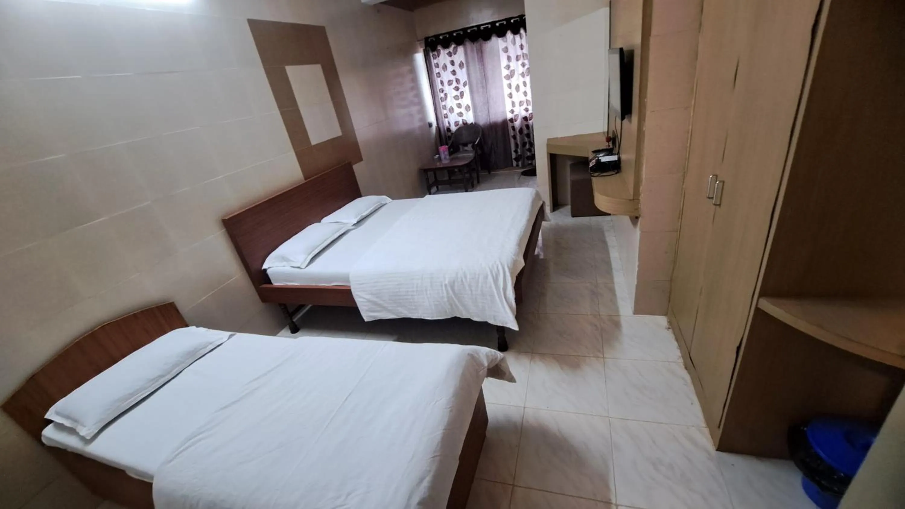 Bed in Hotel Dhruv Palace