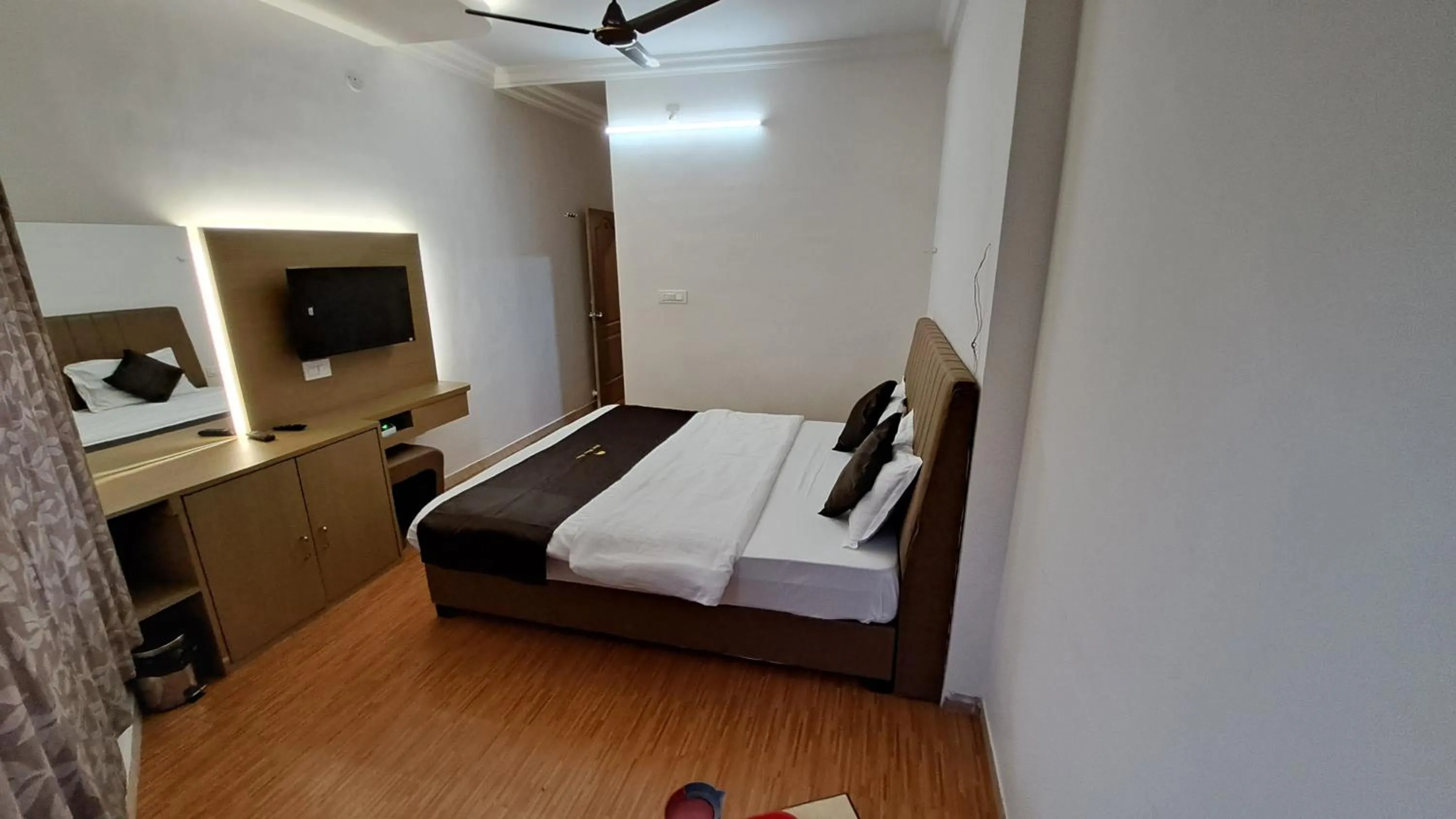 Bed in Hotel Dhruv Palace