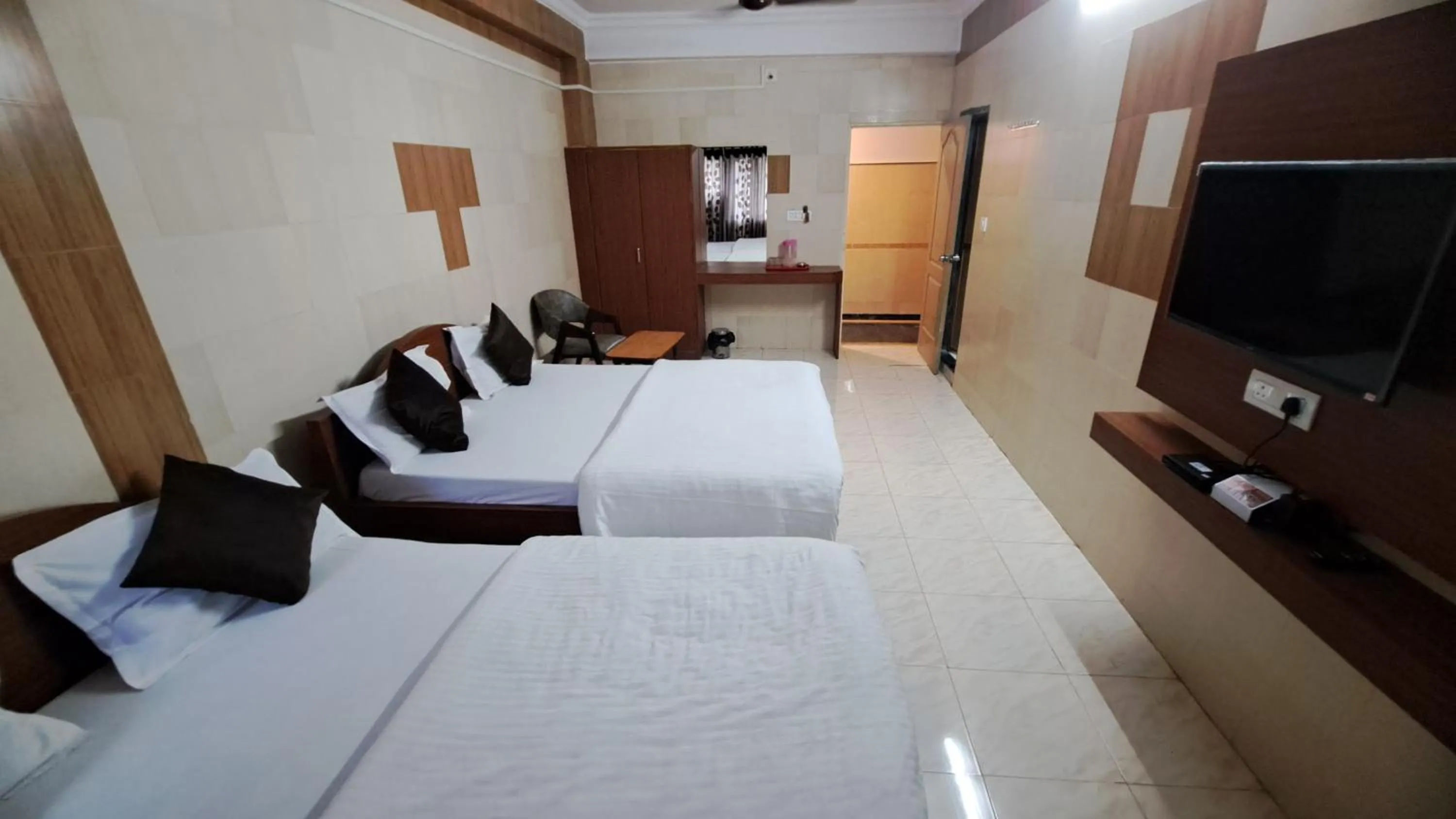 Bed in Hotel Dhruv Palace