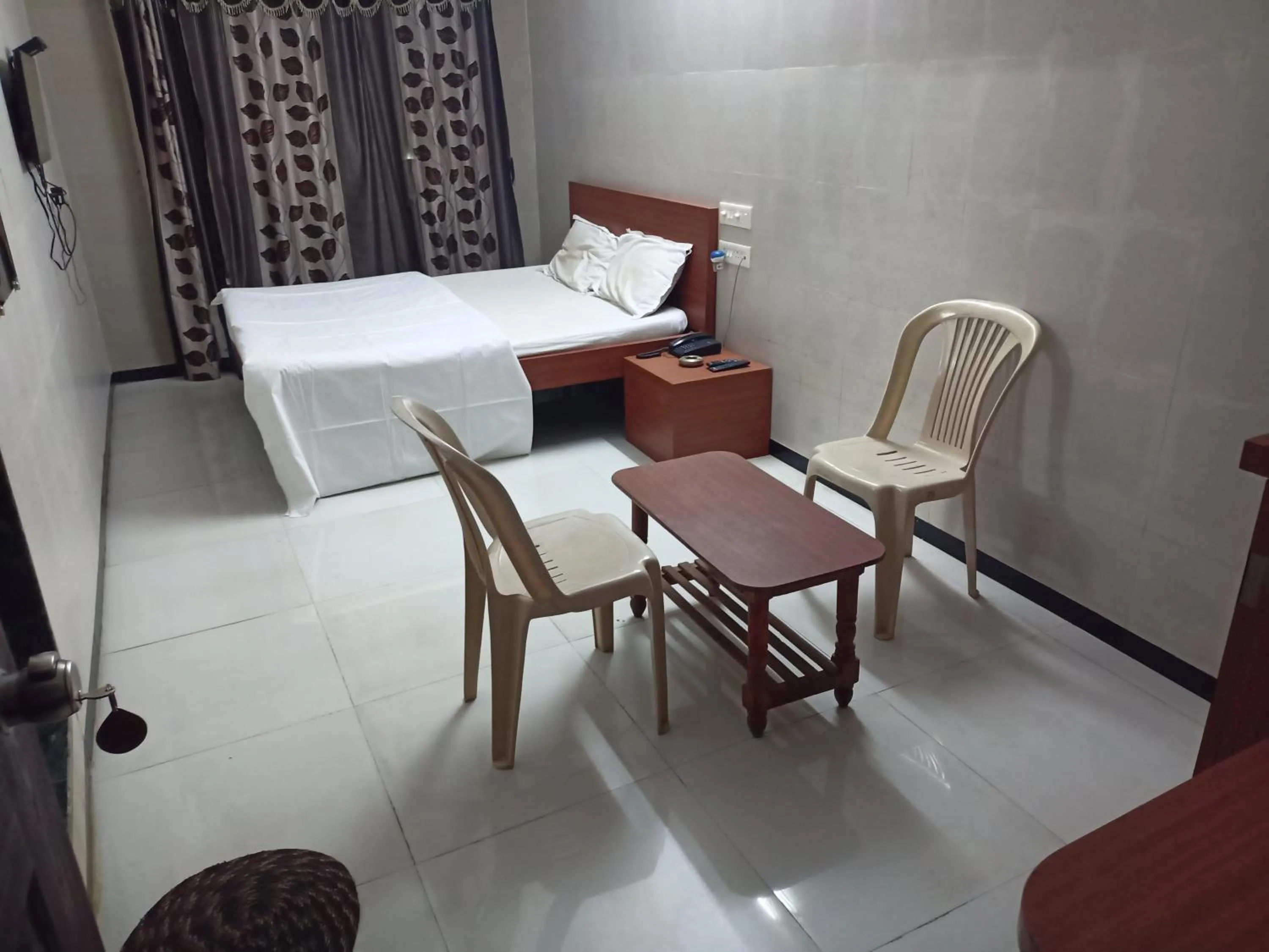 Bed in Hotel Dhruv Palace