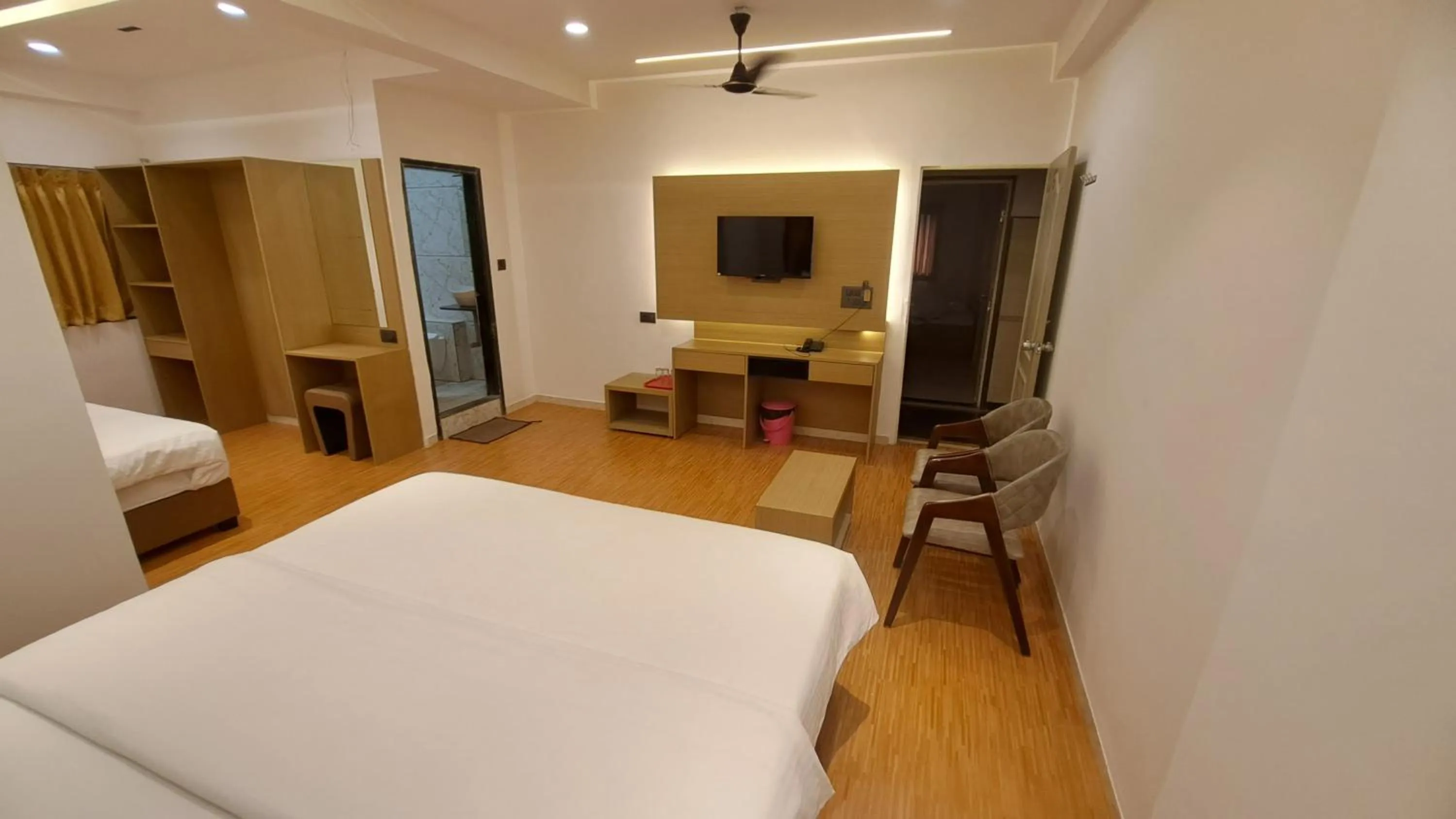 Bed in Hotel Dhruv Palace