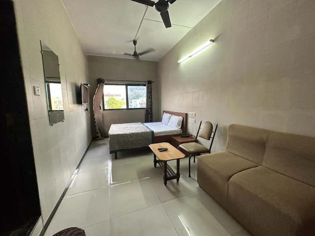 Bed in Hotel Dhruv Palace