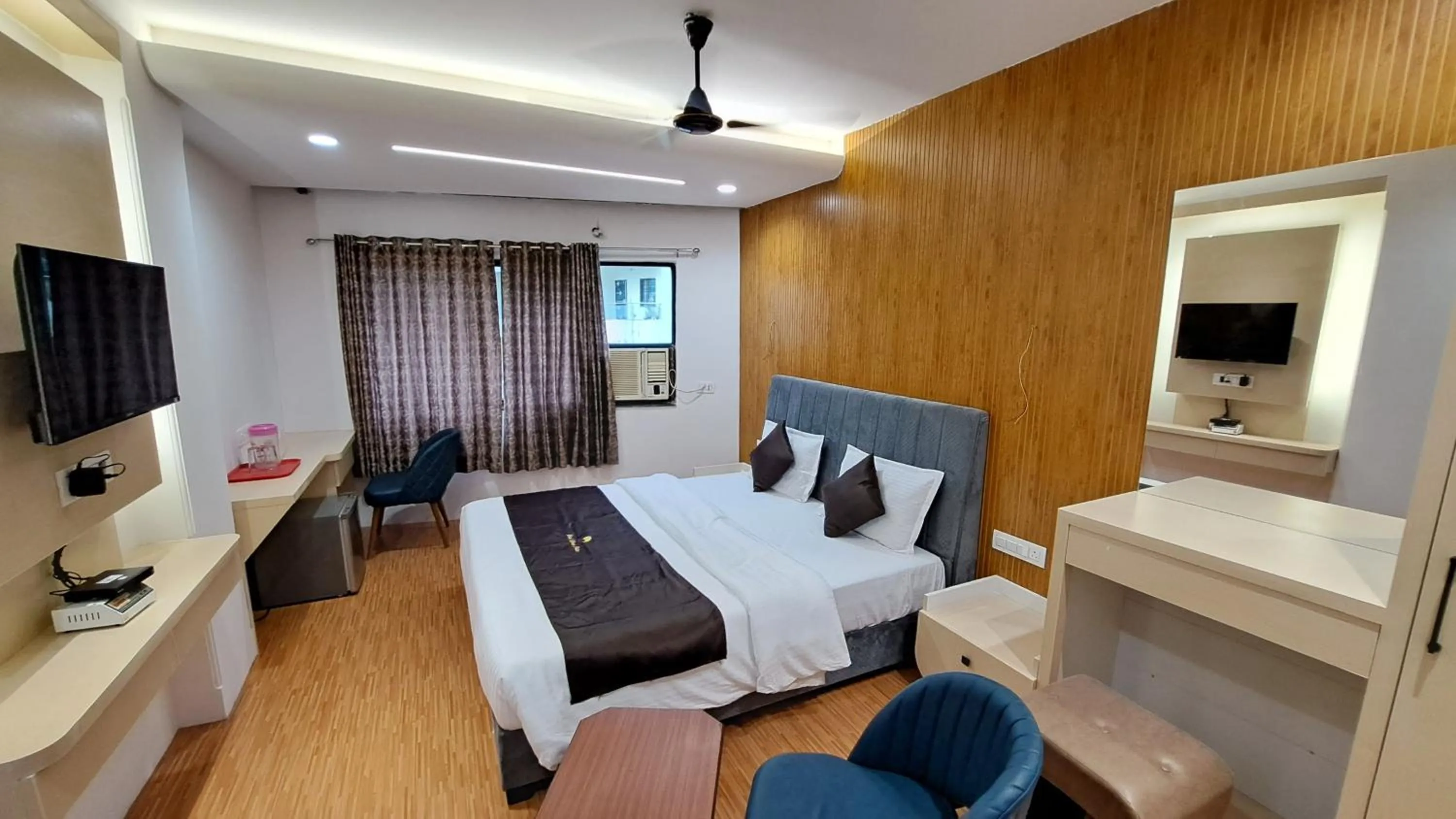 Bed in Hotel Dhruv Palace