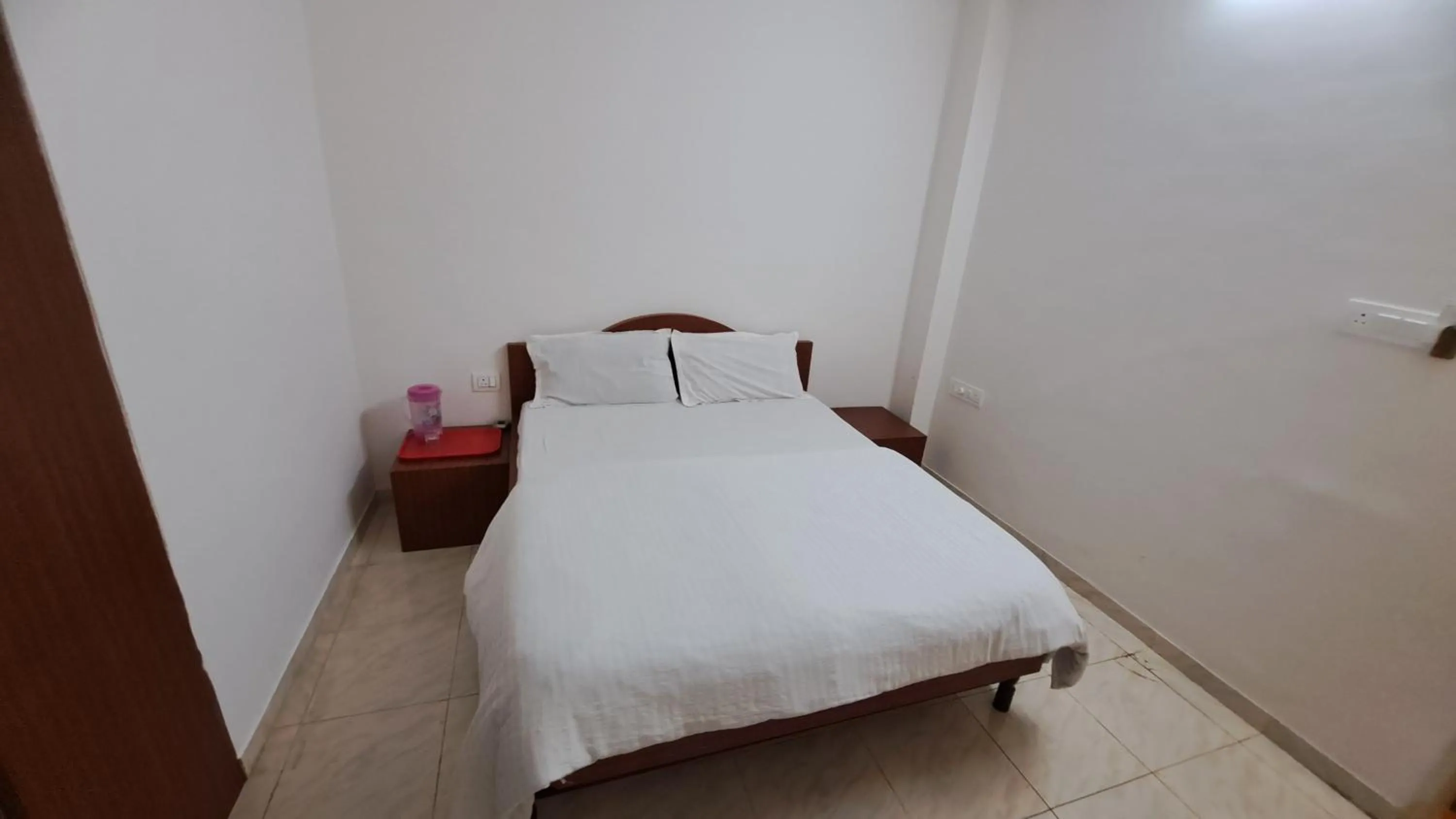 Bed in Hotel Dhruv Palace