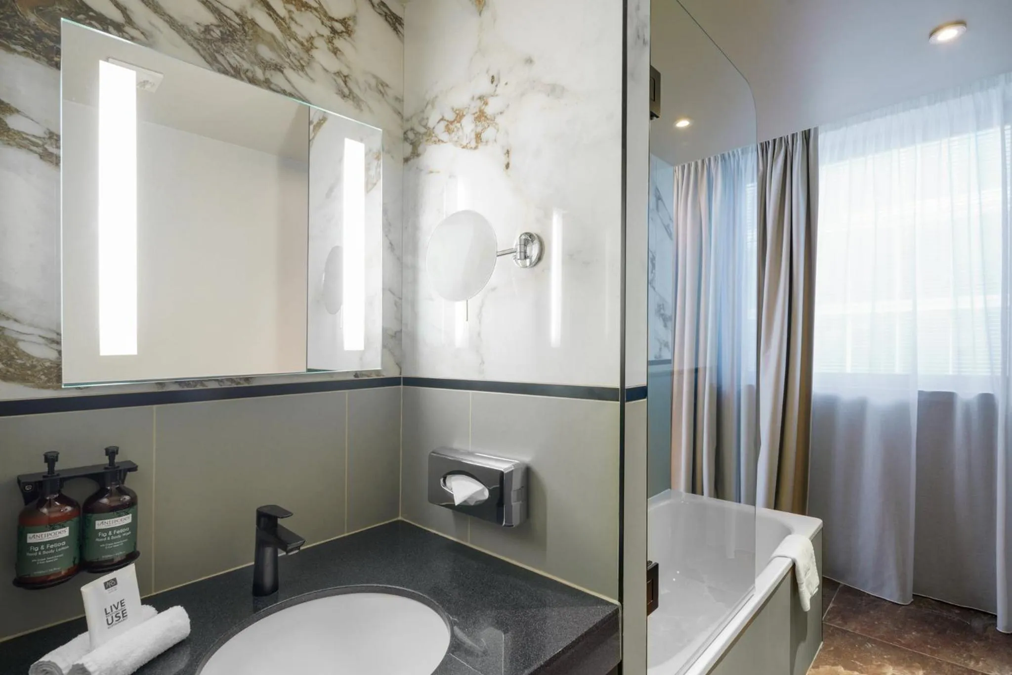 Bathroom in voco Paris - Porte de Clichy by IHG