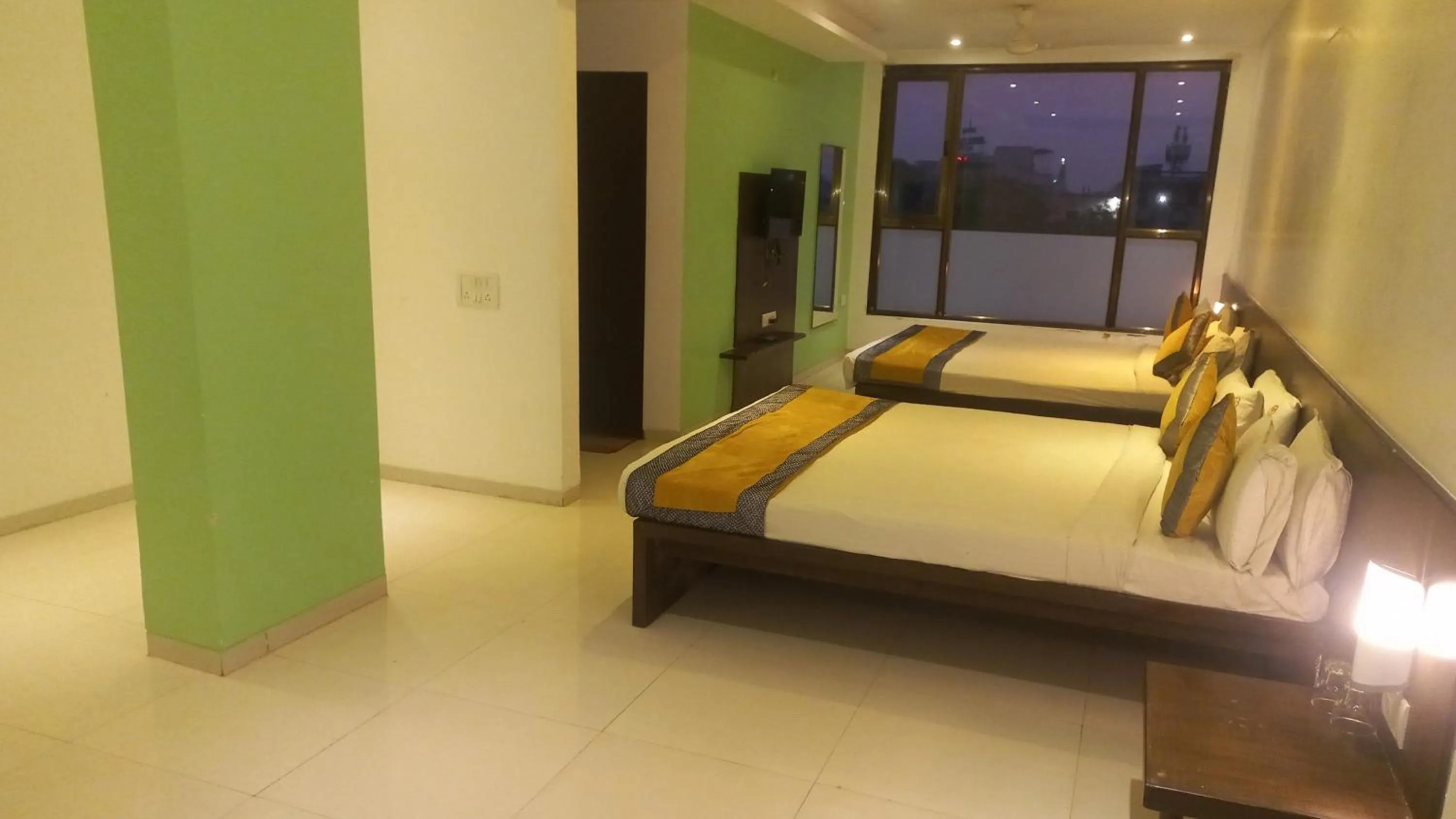 Bed in HOTEL SAI NISARG