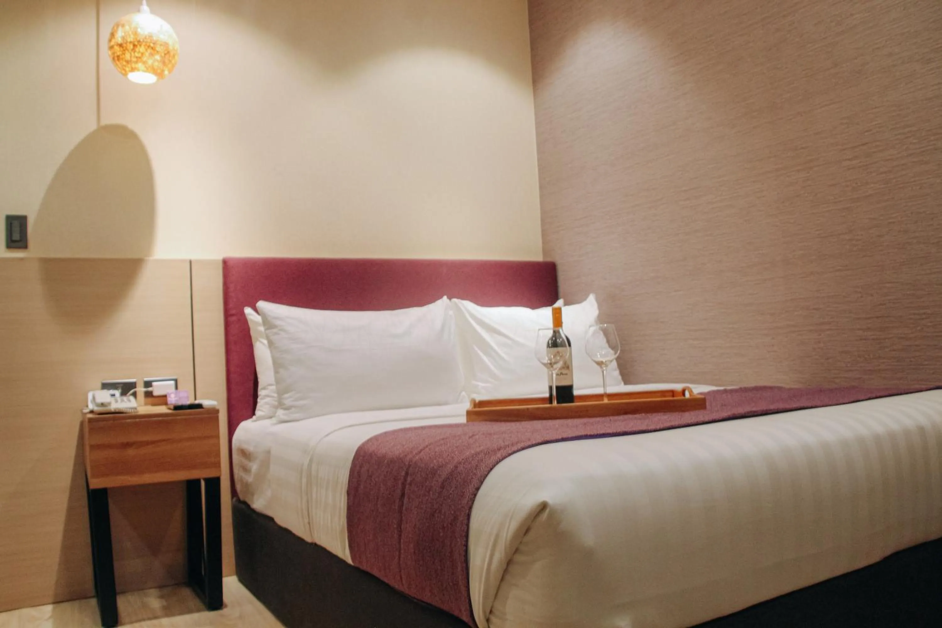 Bed in Goldberry Suites and Hotel Cebu