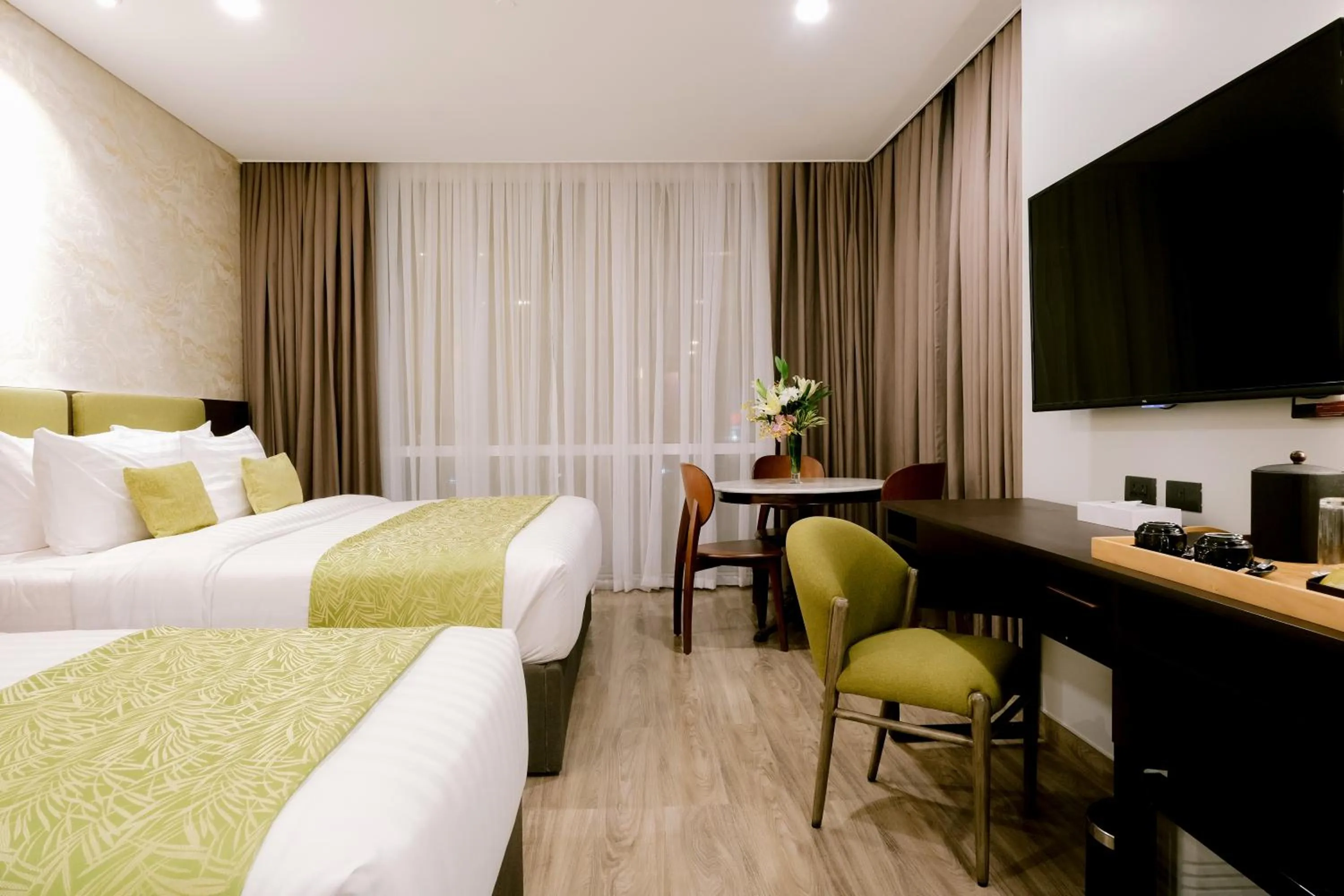 Communal lounge/ TV room, Bed in Goldberry Suites and Hotel Cebu