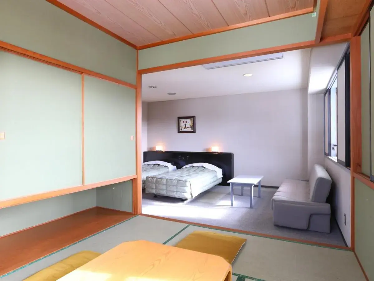 Photo of the whole room, Bed in Hotel Silk Inn Madarao Photo of the whole room, Bed in Hotel Silk Inn Madarao