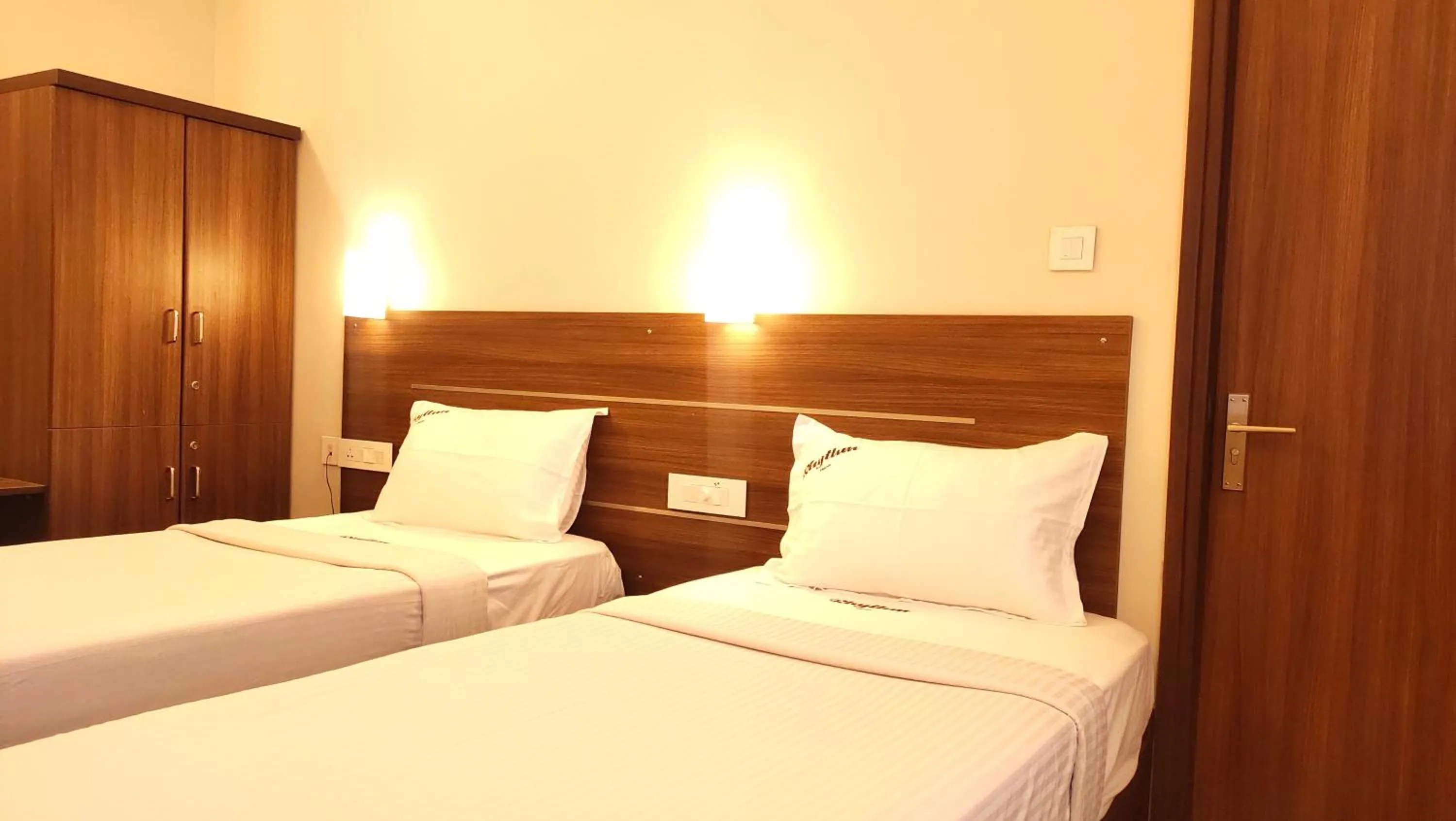 Bed in Hotel Rhythm Grand Suite